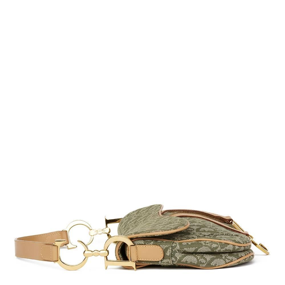 CHRISTIAN DIOR
Khaki Monogram Canvas Saddle Bag

This CHRISTIAN DIOR Saddle Bag is in Excellent Pre-Owned Condition. Circa 2002. Primarily made from Canvas, Calfskin Leather complimented by Gold hardware. Our  reference is HB1768 should you need to