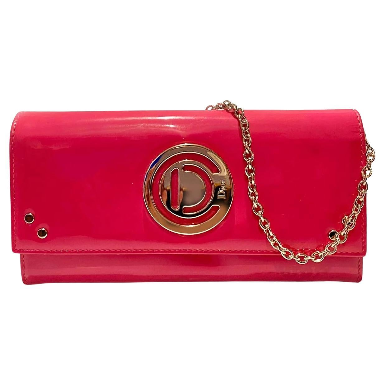 On trend Barbiecore stunning yet practical 2000s Christian Dior wallet / purse on chain, crafted from fuchsia patent leather, flap secures well with snap fastener, leather-fabric interior, Removable gold chain for carrying or converts to clutch,