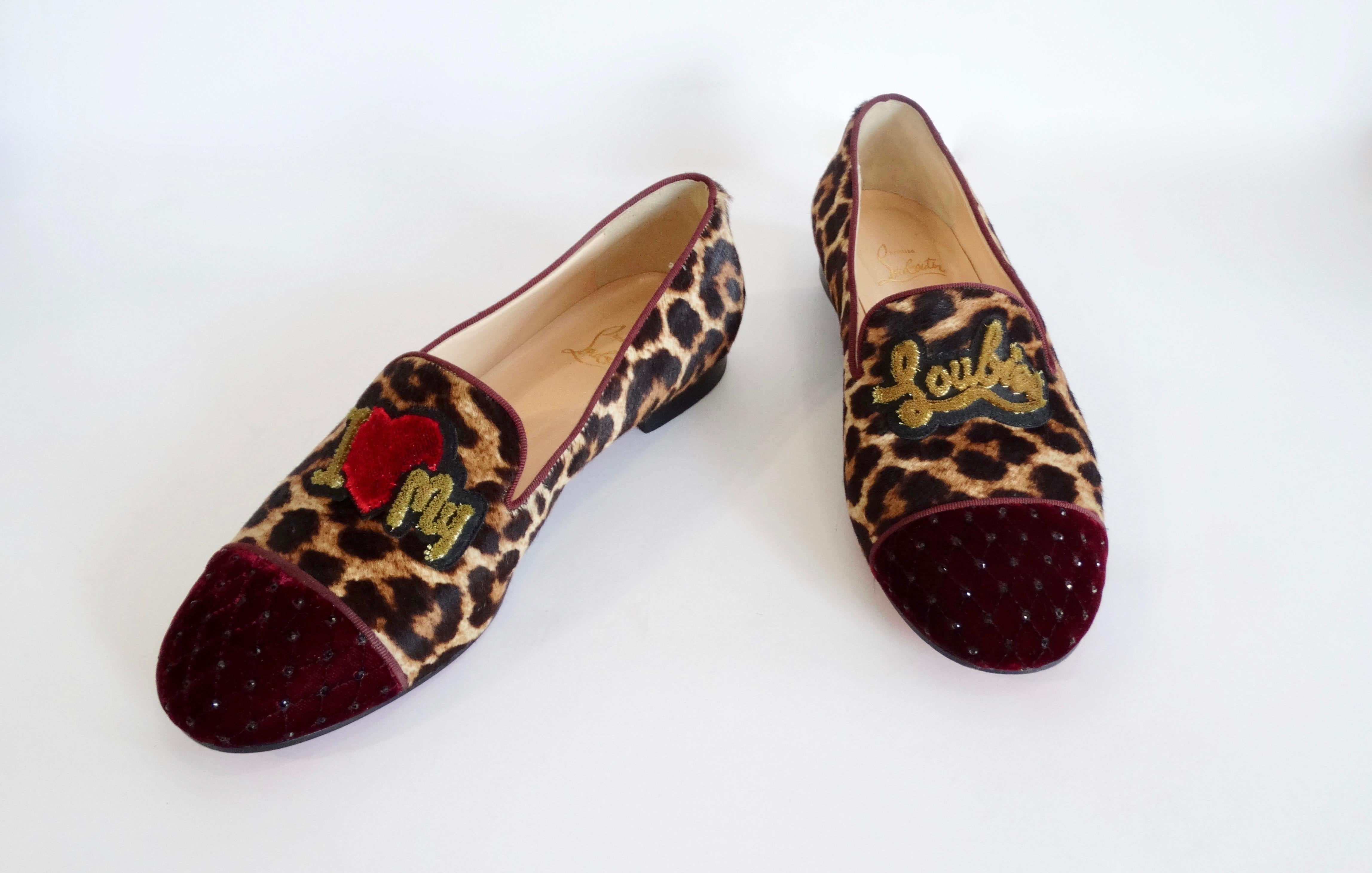 Flash those red bottoms girl! Circa recent 2000s, these Louboutin loafers features leopard print calfskin and a velvet burgundy quilted cap-toe with crystals. Included on the front is 
