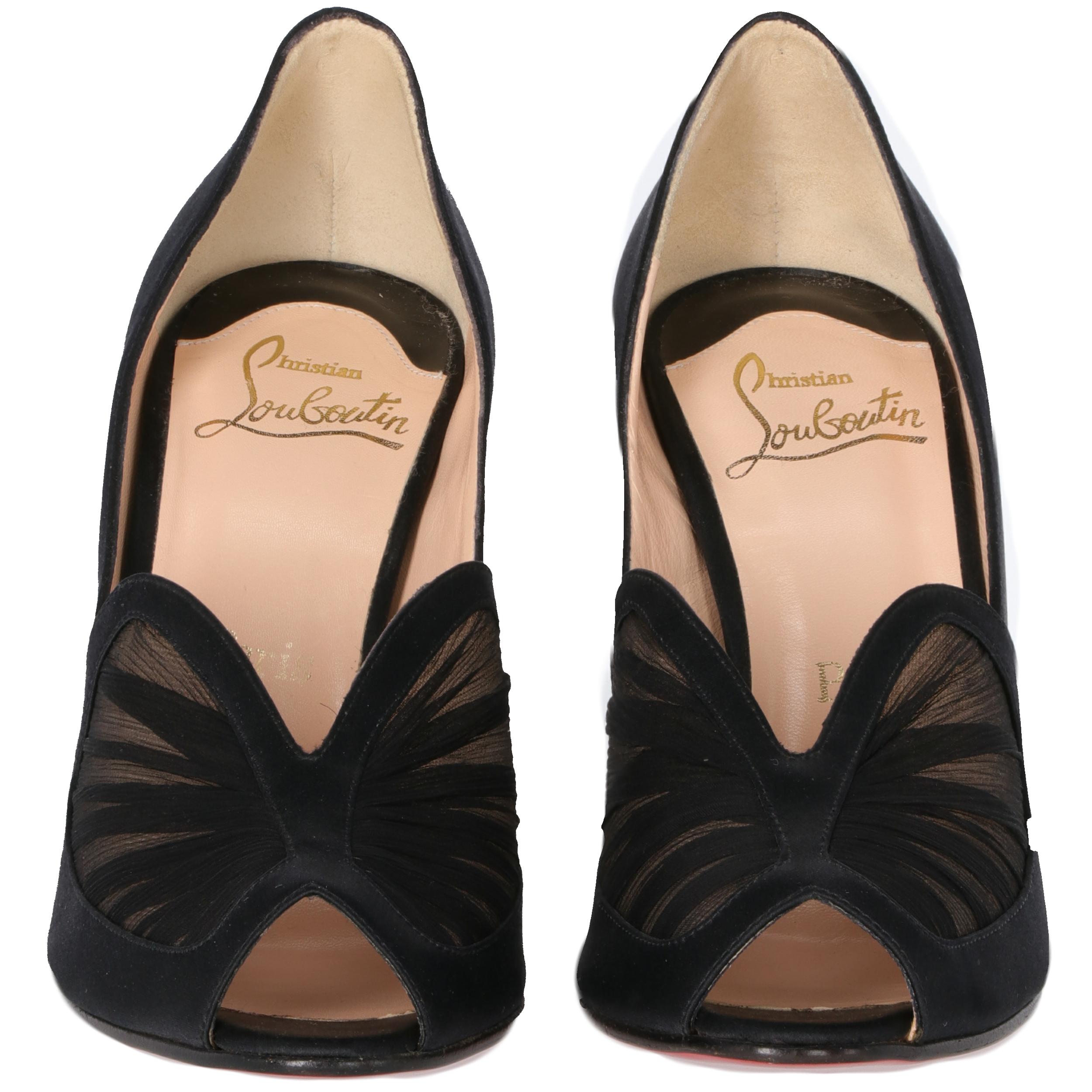 Elegant Christian Louboutin black satin 10 cm heeled shoes with open toes and black silk draped inserts on the toes. With beige leather insoles, the shoes feature the iconic red sole. 
Years: 2000s
Made in Italy

Size: 37.5 EU

Heel height: 10