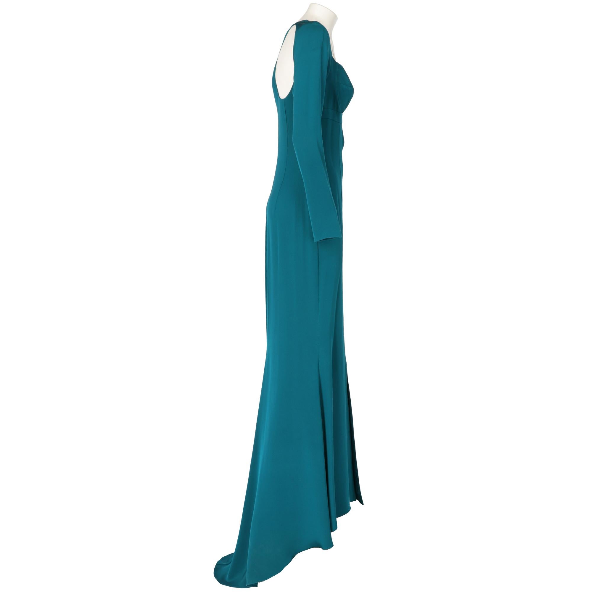 Cushnie et Ochs long train petrol dress, top with breast cups and decorative cut out, long sleeves, zip and hook closure on the back and decorative cut out on the back, large front slit and train on the back. Lined interior.

Years: 2000s

Made in