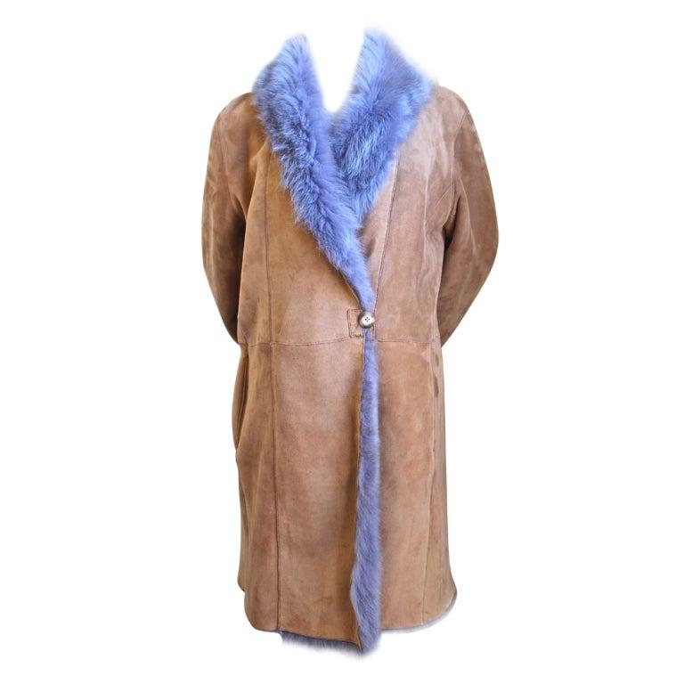 Custom made tan and vivid periwinkle purple reversible shearling coat with fox trim dating to the early 2000's. Fits a size 6 to a 10. Approximate measurements are as follows