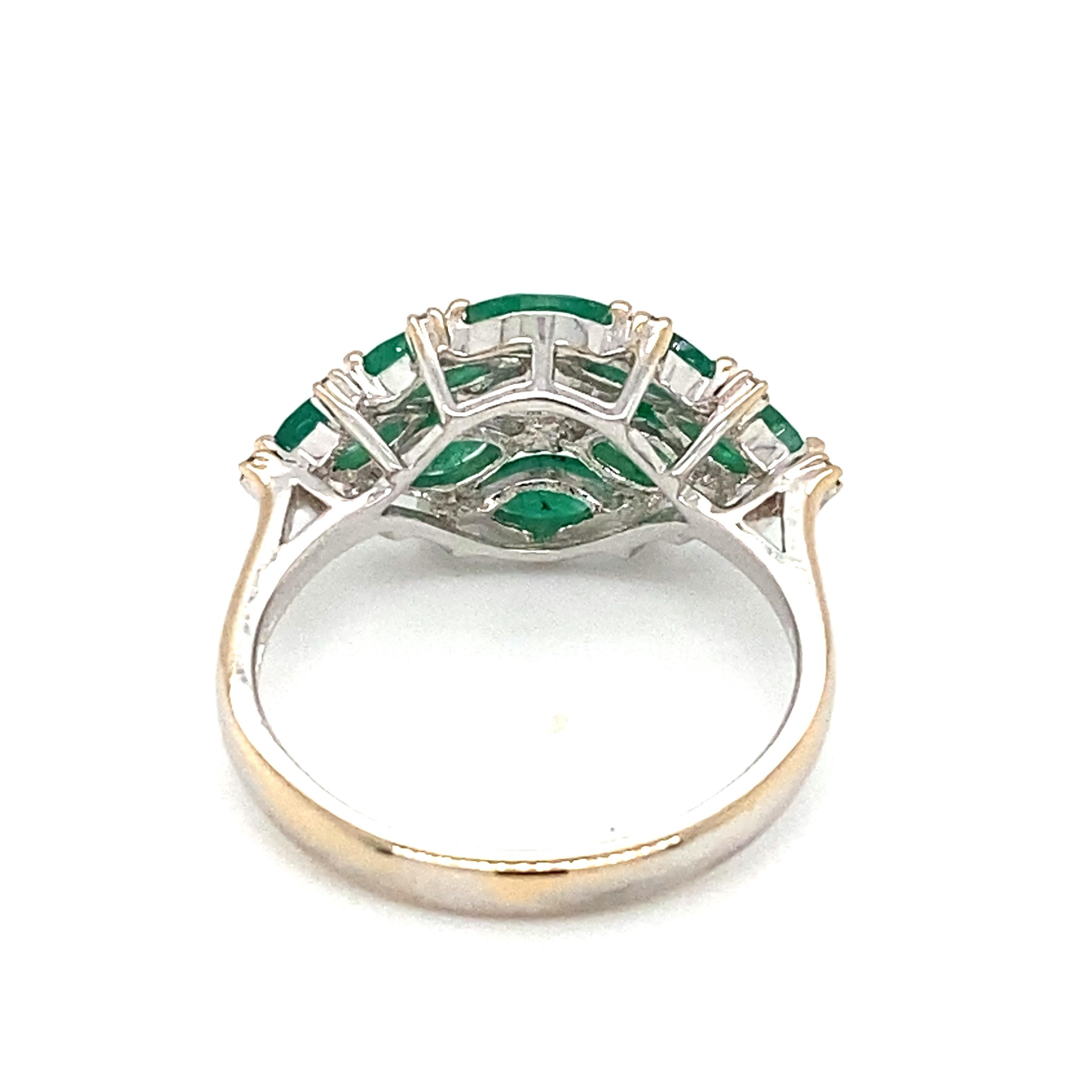 Item Details: This ring by Damas Jewelry has marquise emeralds with accent diamonds. The contrast of colors from the emeralds to the white gold with a pop of diamond sparkle is absolutely stunning. 

Circa: 2000s
Metal Type: 18 Karat White