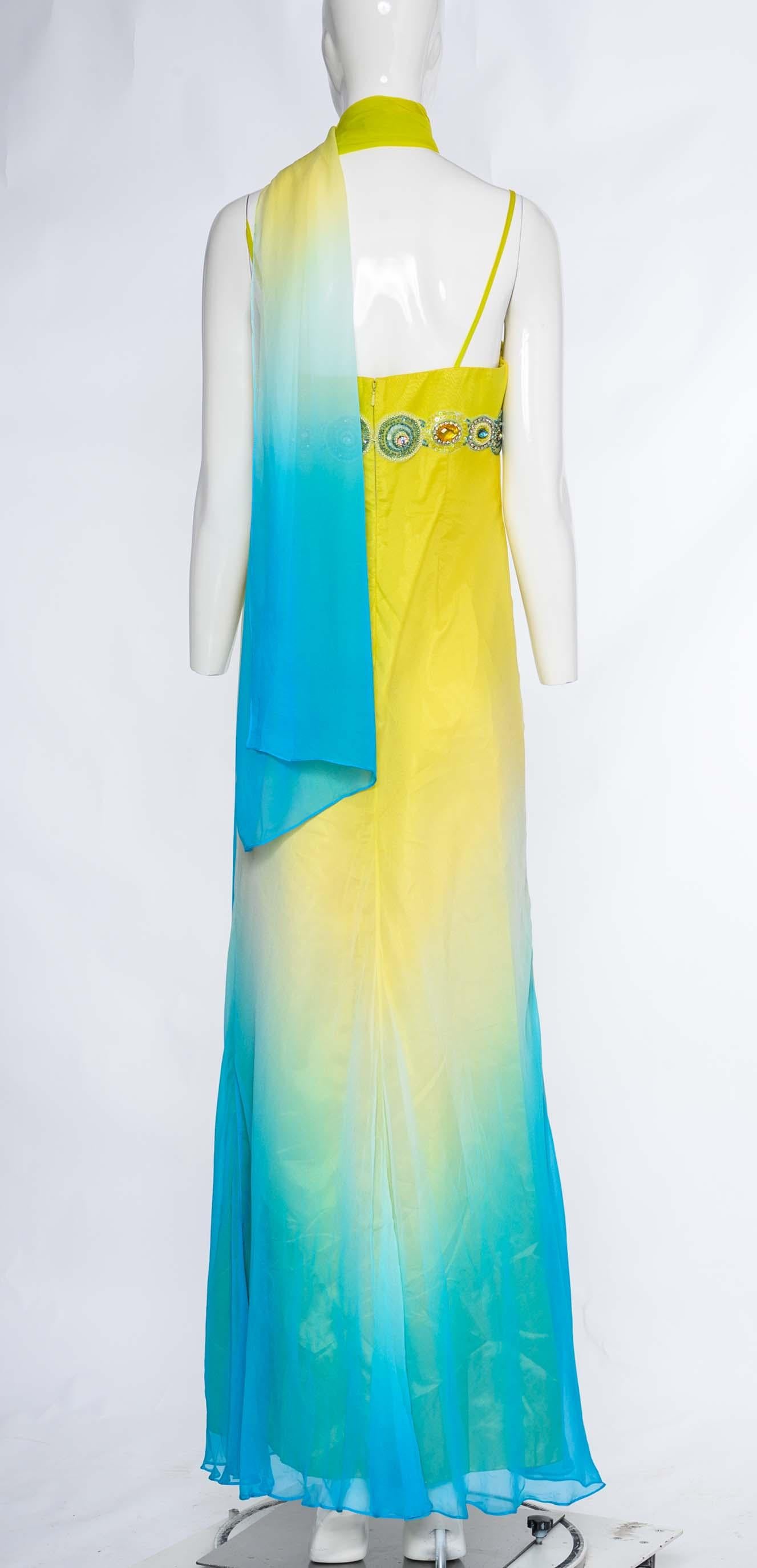 Step back in time with this stunning vintage 2000s Diane Freis dress. Crafted from luxurious yellow and blue silk, this dress exudes elegance and sophistication. The ombre effect adds a touch of artistic flair, transitioning from a vibrant yellow