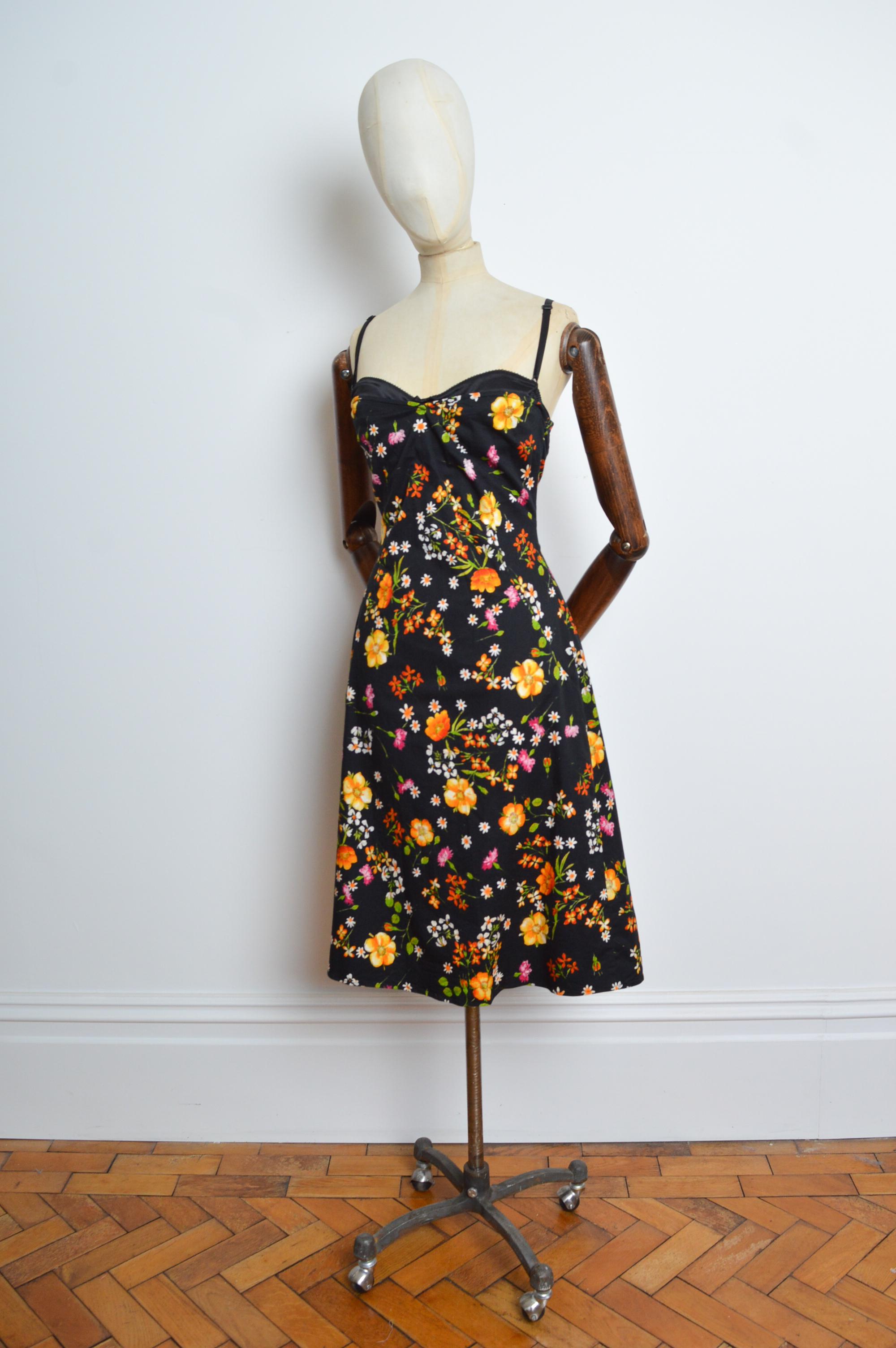 Dolce & Gabbana 2000s Cotton printed dress with a delicate orange and pink blossom print, strappy shoulders, exposed bra-let and past the knee length hem.
MADE IN ITALY.
Size; Recommended Small / UK 6-8. 
Measurements are provided in inches