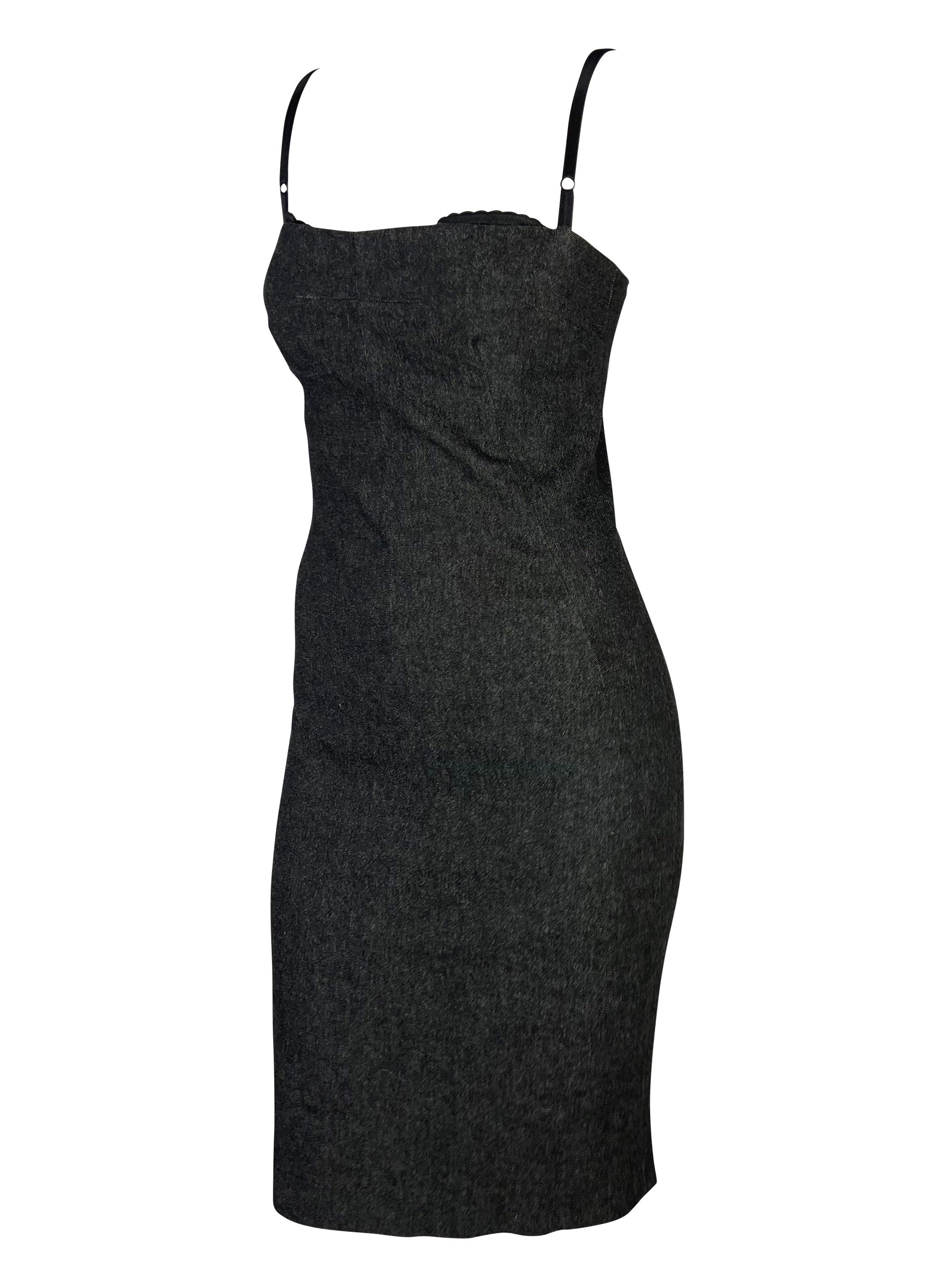 Presenting a beautiful dark denim bodycon Dolce and Gabbana pin-up dress. From the late 90s / early 2000s, this gorgeous dress is constructed of dark faux denim and features a square neckline. The dress has an internal lace bra sewn in that