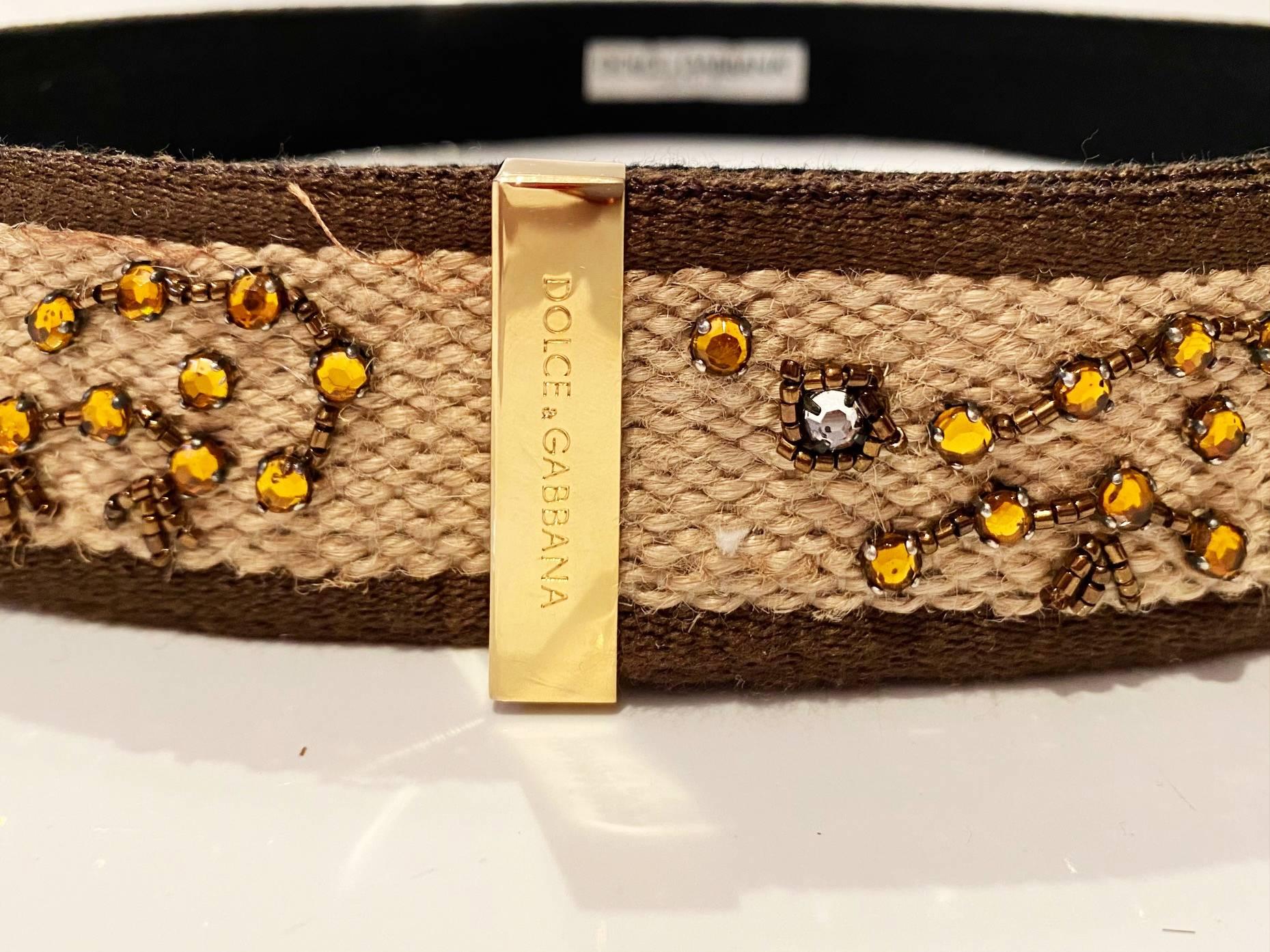 Dolce & Gabbana brown belt in cord with rhinestone details, Velcro closure with gold tone metal closure, Made in Italy  The high-quality Italian craftmanship on this belt makes it a reliable wardrobe staple that won't show signs of wear and tear