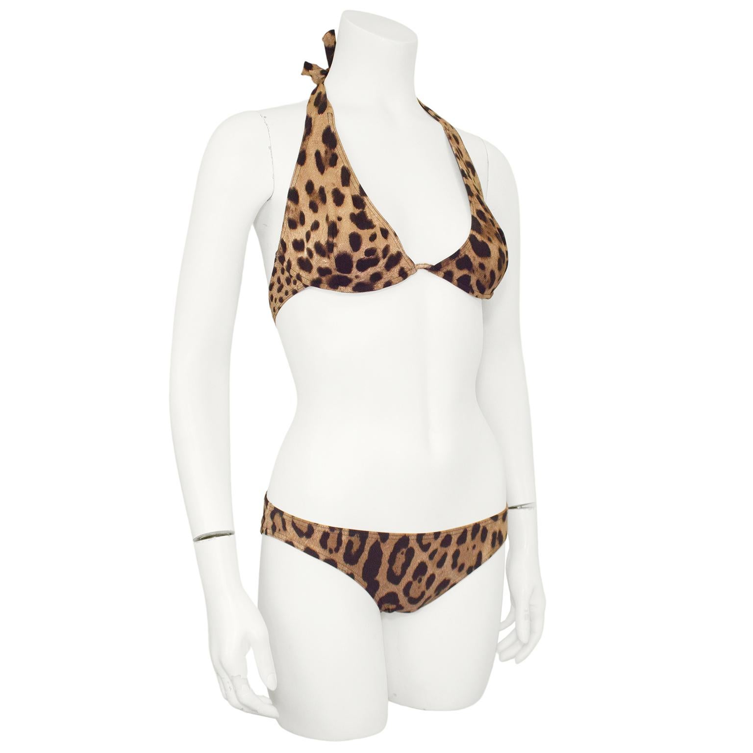 Very fun 2000s Dolce and Gabbana Beachwear leopard print bikini. Halter tie top with underwires and interlocking DG gold tone metal clasp. Low rise bikini bottom. Black lining. Marked size 3, fits like a US size 2-4. Made in Italy. Excellent vintage