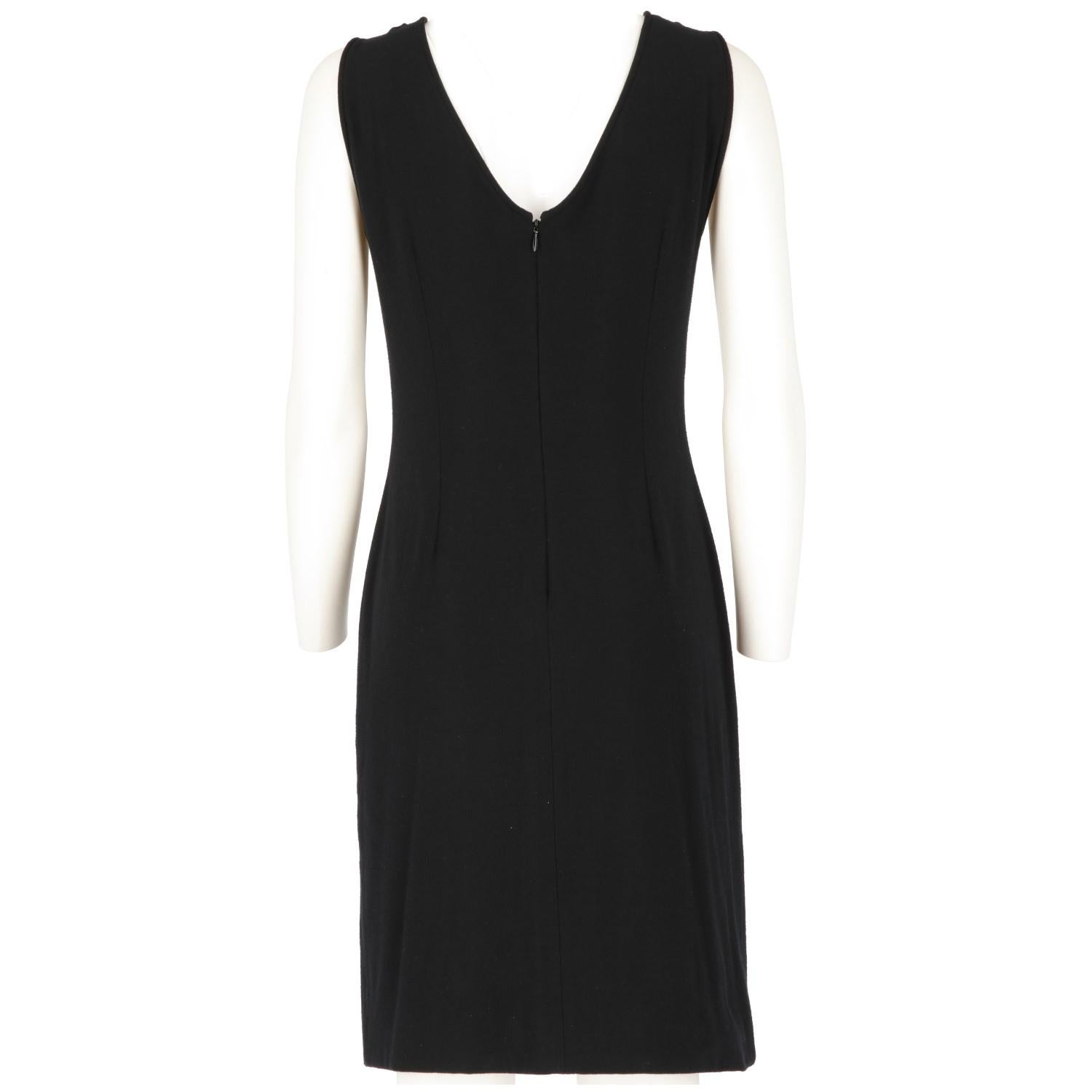 Dolce & Gabbana black stretch sleeveless minimal dress, featuring a front boat neck and a back V-neck. Zip fastening on the back.
This essential piece is vintage and shows light signs of wear on the fabric.

Years: 1990s

Made in Italy

Size: 42