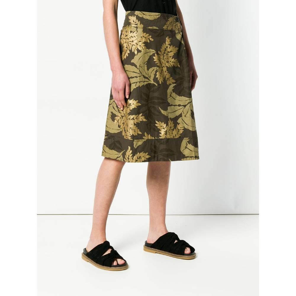 Dries van Noten trapeze skirt in brown cotton with beige and gold floral print. High waist, button closure, front crease and patch pocket with flap and button and welt pockets inserted in the seam.
Years: 2000s

Made in Belgium

Size: 38 FR

Flat