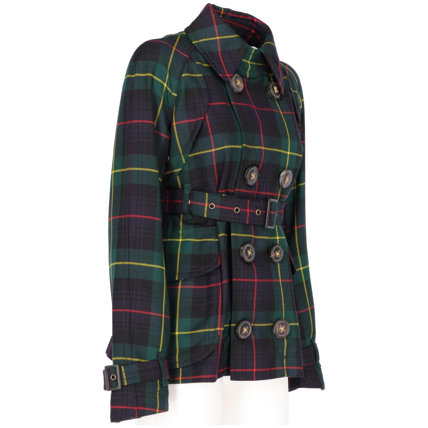 Dsquared2 tartan wool short trench coat in blue, green, yellow and red colors. Double-breasted front closure with thick buttons, waist belt with buckle, strap and buckle cuffs, classic collar with strap and button detail, two side pockets with flap,