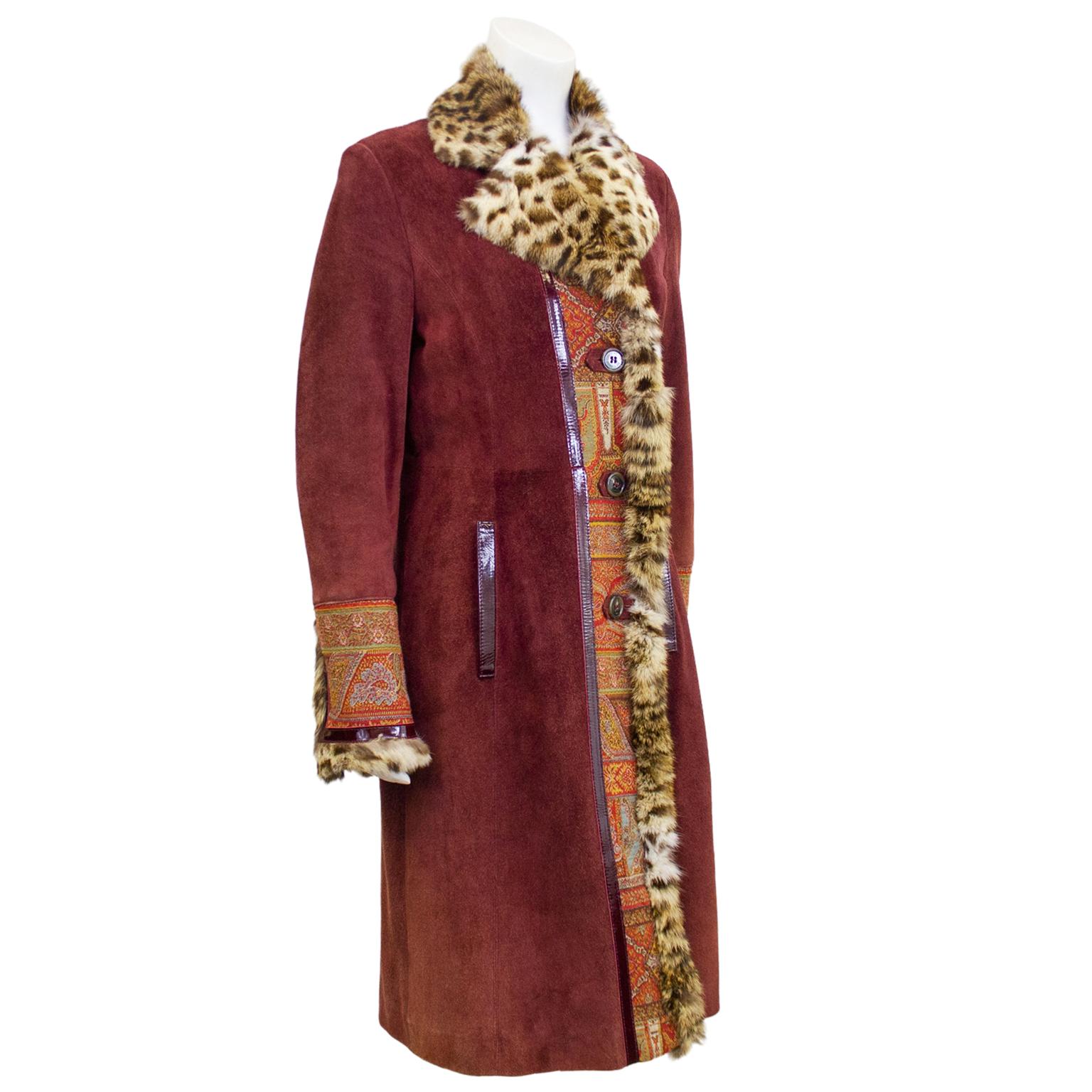 2000's Etro long coat. Burgundy suede with matching patent leather trim on the pockets cuffs and side seams on front and back. Show stopping detail is the faux stencilled fur notched collar, down the centre front and at cuffs. Additional details