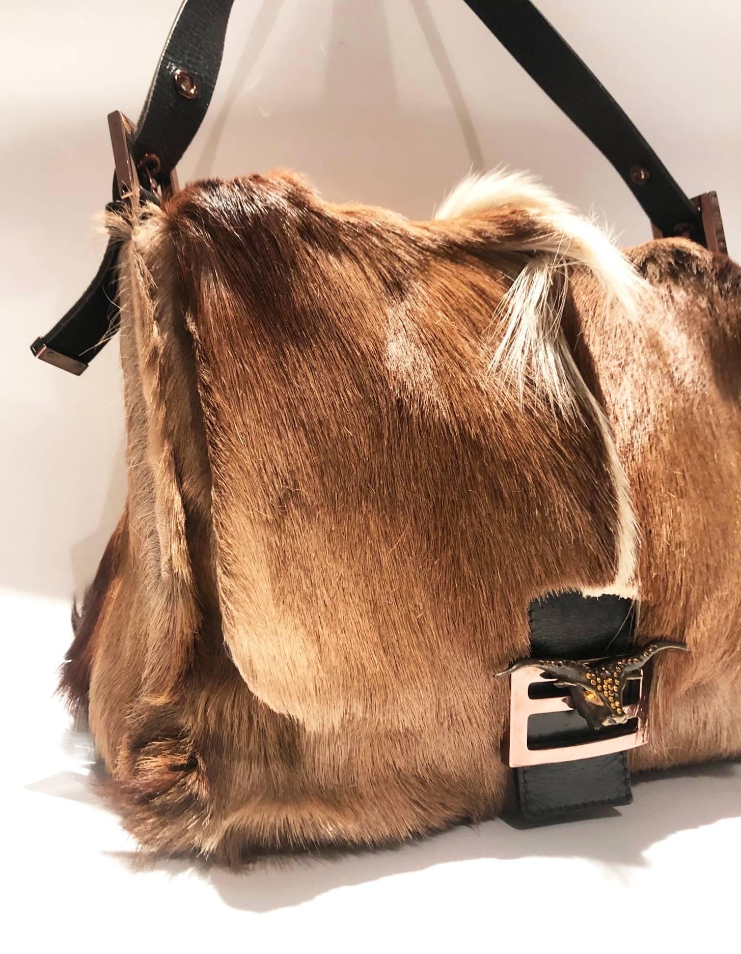 FREE UK and WORLDWIDE DELIVERY 

Extremely rare mamma baguette shoulder bag featuring fur, FF logo with buffalo head on top embellished with crystals, adjustable leather shoulder strap, fold over top with magnetic fastening, main compartment,