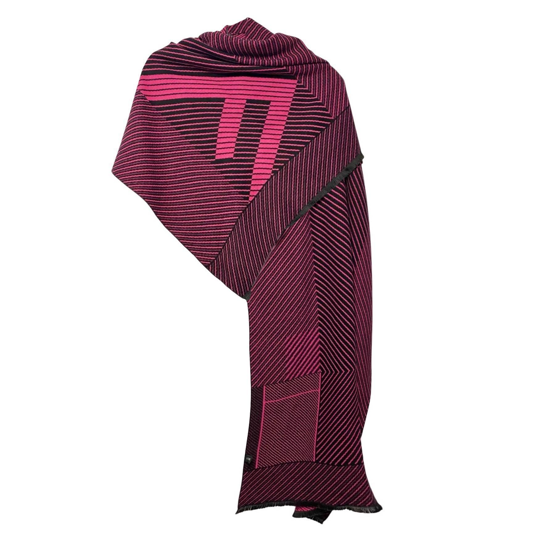 This timeless 2000s Fendi shawl exudes classic Italian elegance, Crafted from luxurious wool and featuring the renowned F logo printed on one side, it ensures an exclusive yet stylish accessory for any wardrobe. 
Condition: 2000s, vintage, very good