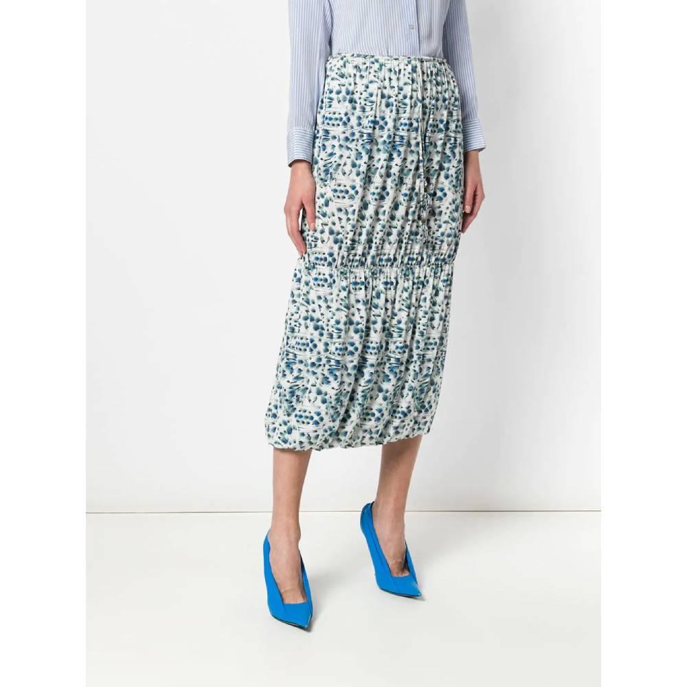 Fendi white midi skirt with abstract print in shades of blue, green and black. Balloon model with elastic and drawstring waist.
Years: 2000s

Made in Italy

Size: 42 IT

Linear measures:

Lenght: 84 cm
Waist: 39 cm