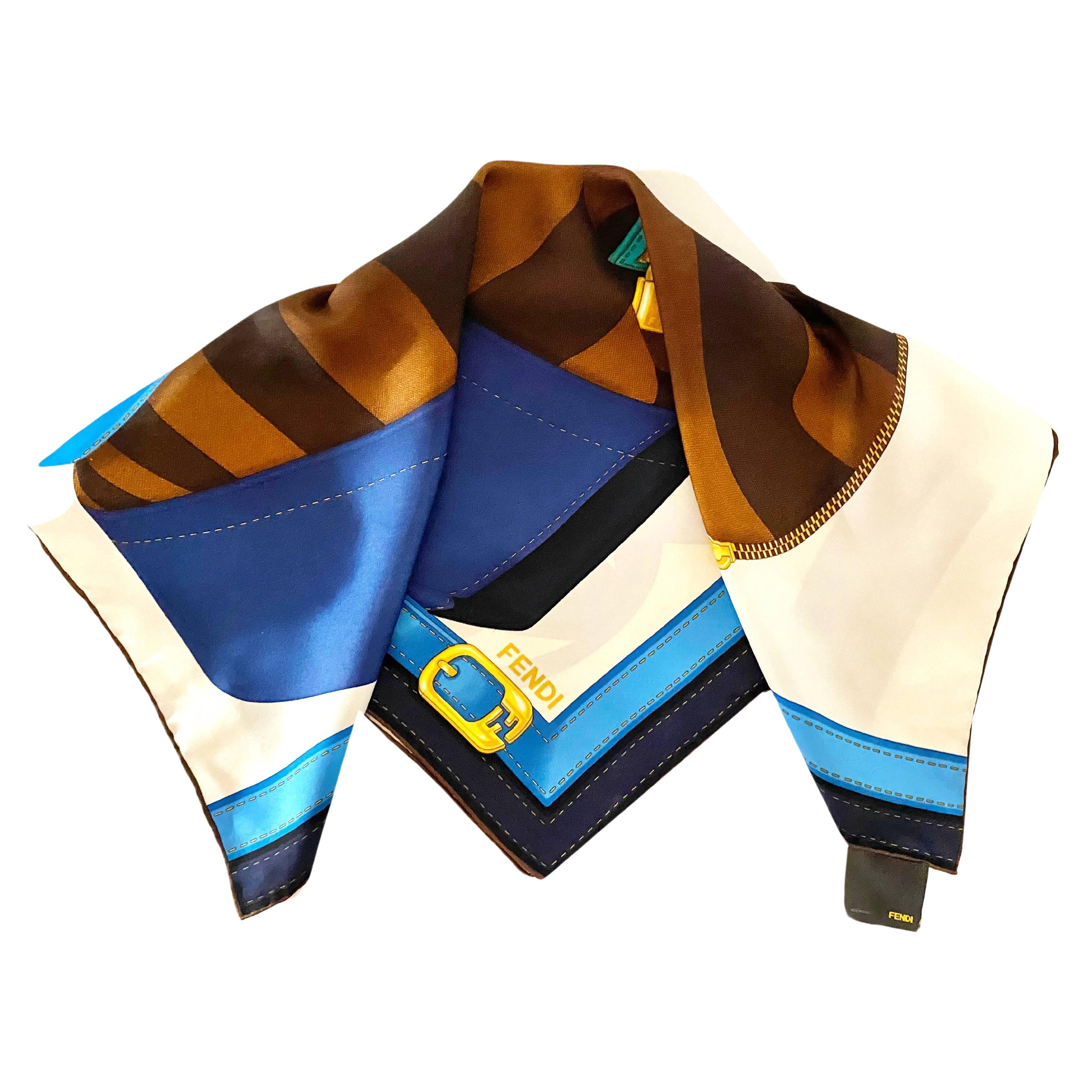 Elegant silk scarf by Fendi. The TWO BAGS Brown Blue and Black Silk Scarf has Blue  color and features an impressive Fendi bag in yellow, brown and gold color, 100% Silk , Made in Italy, Dry clean only

Condition: 2000s, vintage, very good


