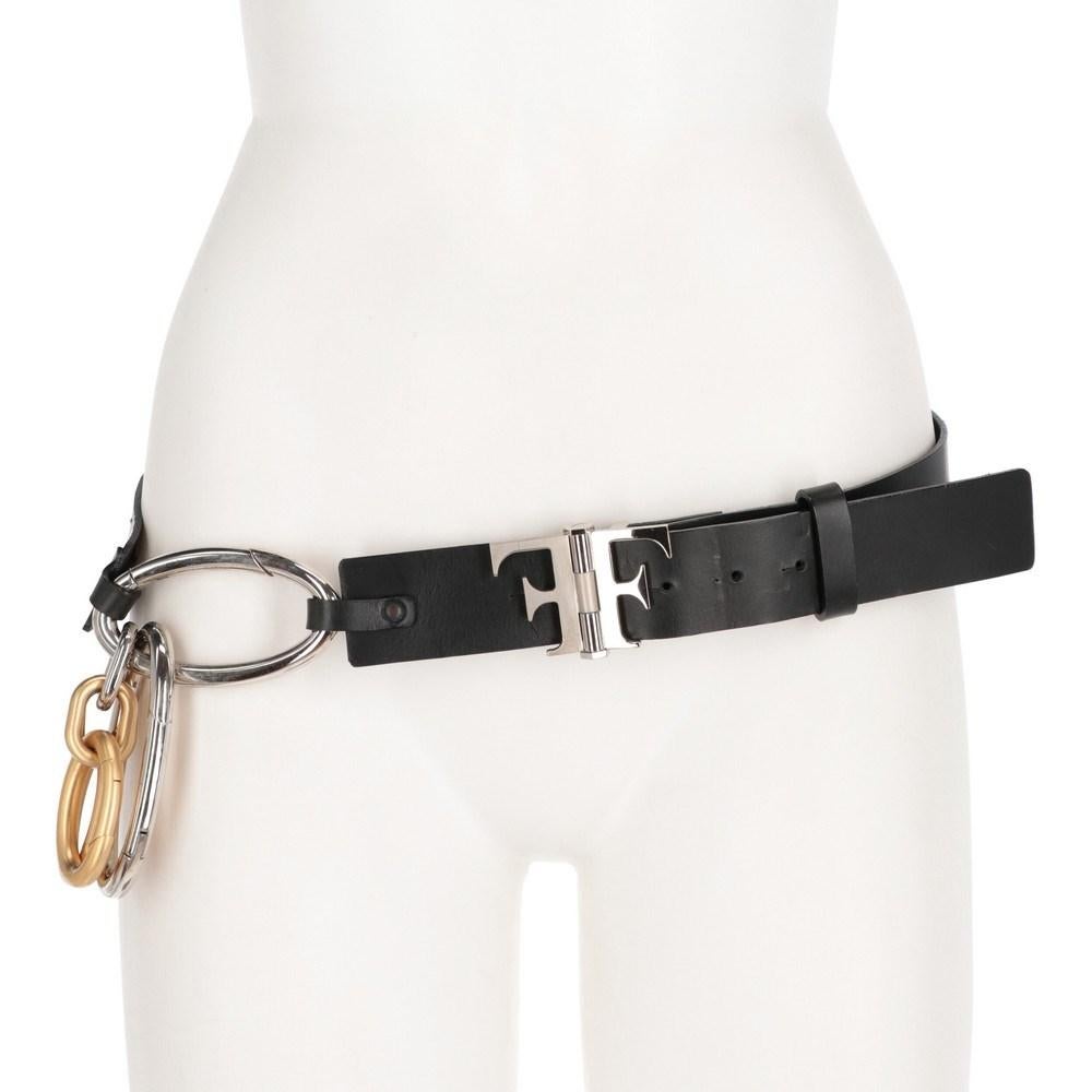Gianfranco Ferré black leather belt. Front closure with logoed buckle and decorative carabiners in gold and silver metal.

Measurements
Length: 85 cm
Height: 4 cm

Product code: X0682

Notes: Item shows light signs on the leather, as shown in the