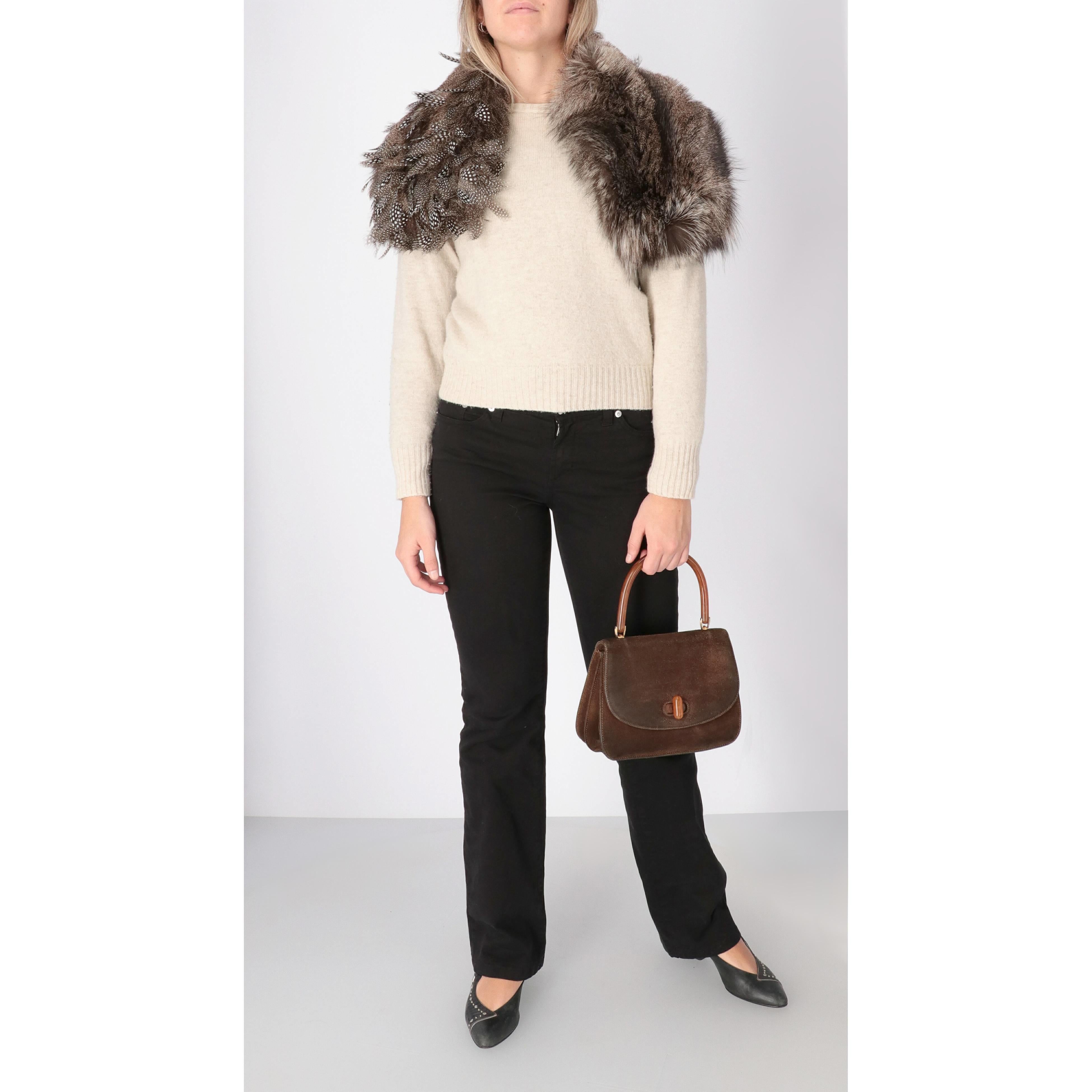 Gianfranco Ferré collar in real silver fox fur and black feathers with white polka dots. Lined in white fabric with black stripes.

Please note this item cannot be shipped outside the European Union.

Years: 2000s

Made in Italy

Measurements: