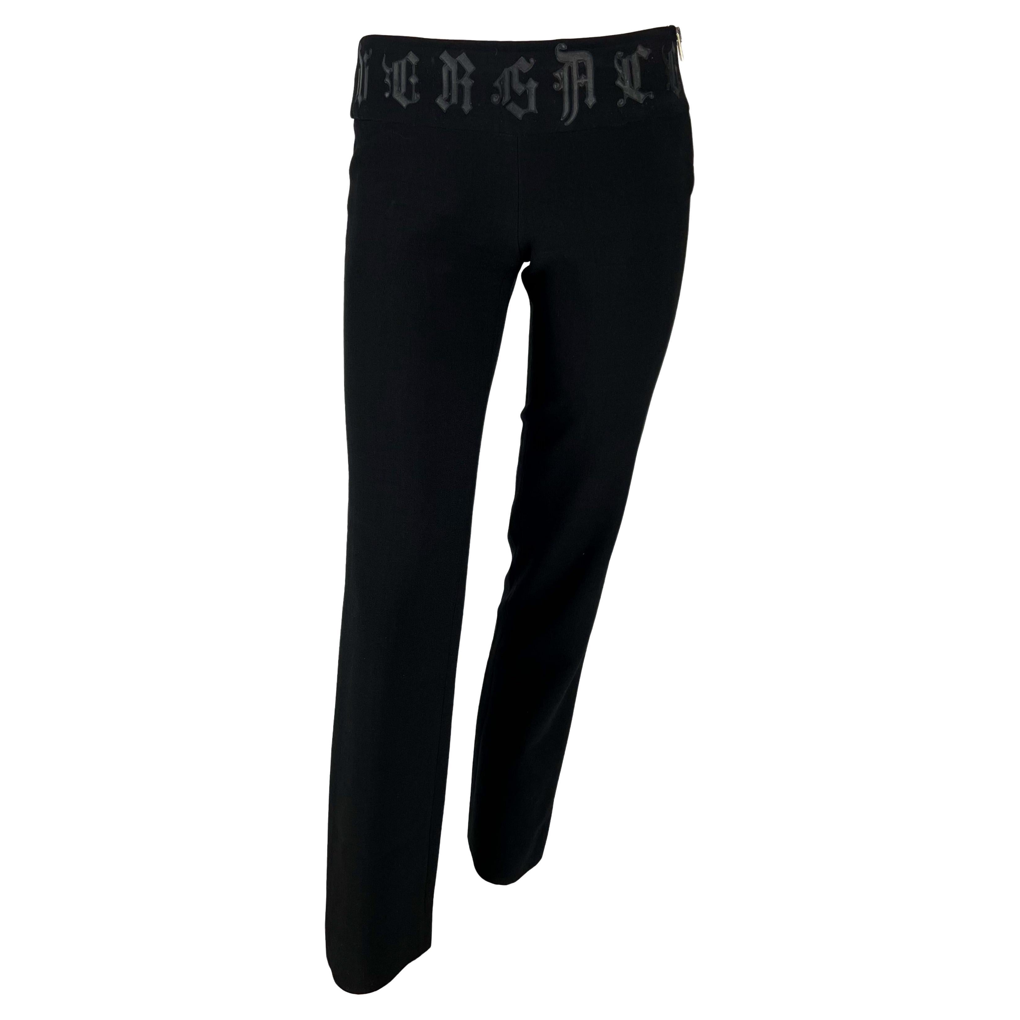 2000s Gianni Versace by Donatella Black Wool Leather Logo Appliqué Pants For Sale