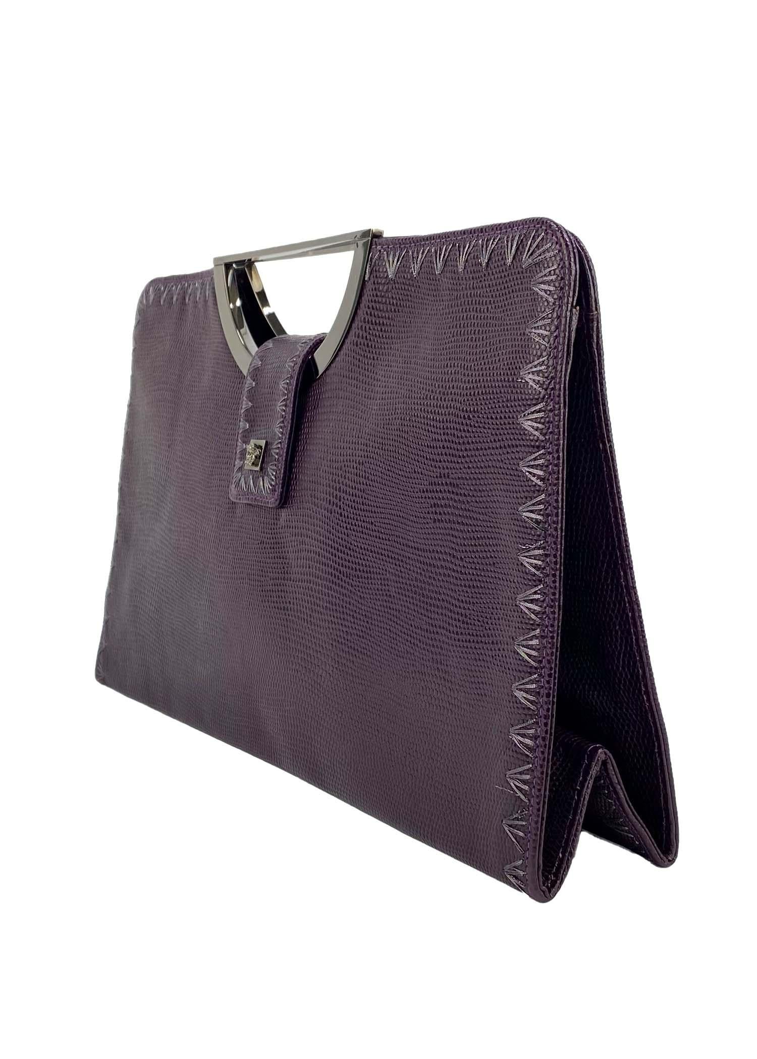 Presenting a purple lizard-embossed Gianni Versace frame bag designed by Donatella Versace in the early 2000s. This Y2K bag features a gunmetal Medusa medallion on the magnetic closure strap and embroidery along the edges. Seek and expertly crafted,
