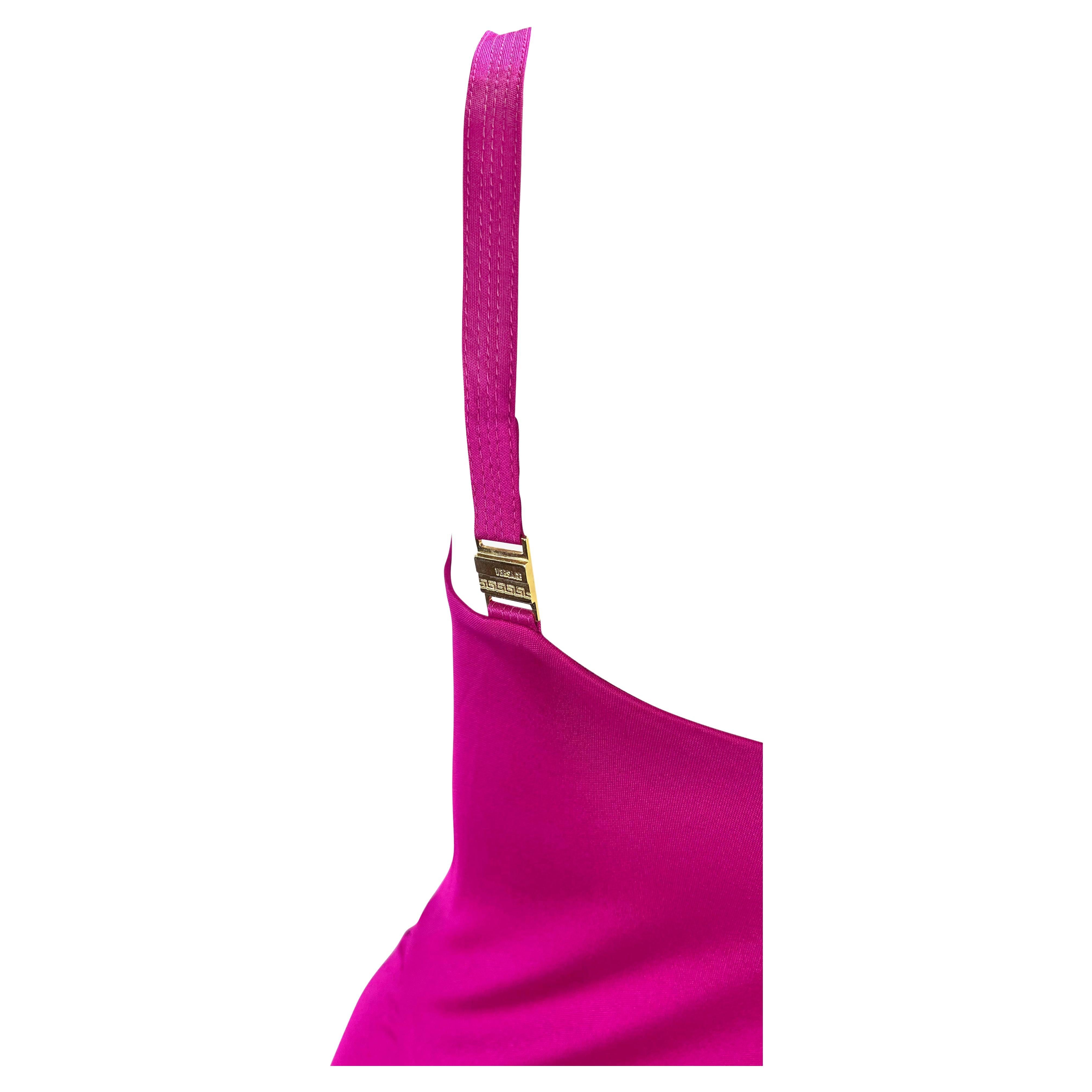 Presenting a gorgeous fuchsia Gianni Versace Couture slip dress, designed by Donatella Versace. From the early 2000s, this beautiful dress is a Y2K dream made complete with a cowl neck, flared hem, and thin straps. The dress is highlighted with