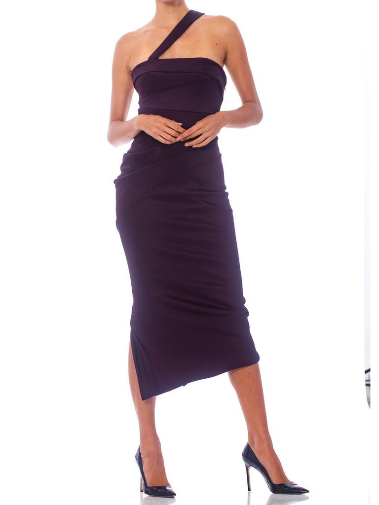 Beautifully made with boned interior bodice. Several tiny minor snags to the fabric but in overall great shap with original deadstock tags. Italian size 38 2000S DONATELLA VERSACE Eggplant Rayon Blend Jersey One Shoulder Strapless Sexy Cocktail