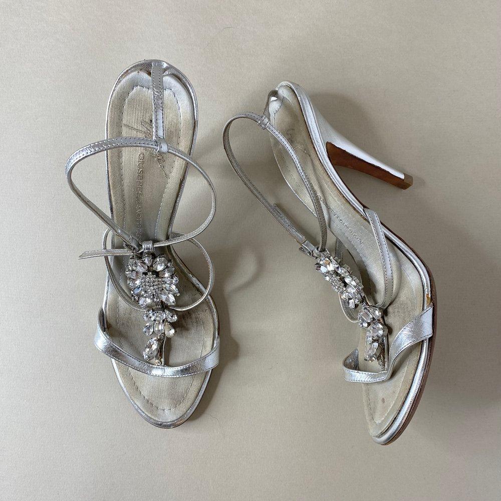 Vintage silver and crystal strappy heeled sandals designed by Giuseppe Zanotti, incredibly rare and highly sought after collection. In a silver leather finish with brand signature stitched into the footbeds. One of our favourite pairs to date