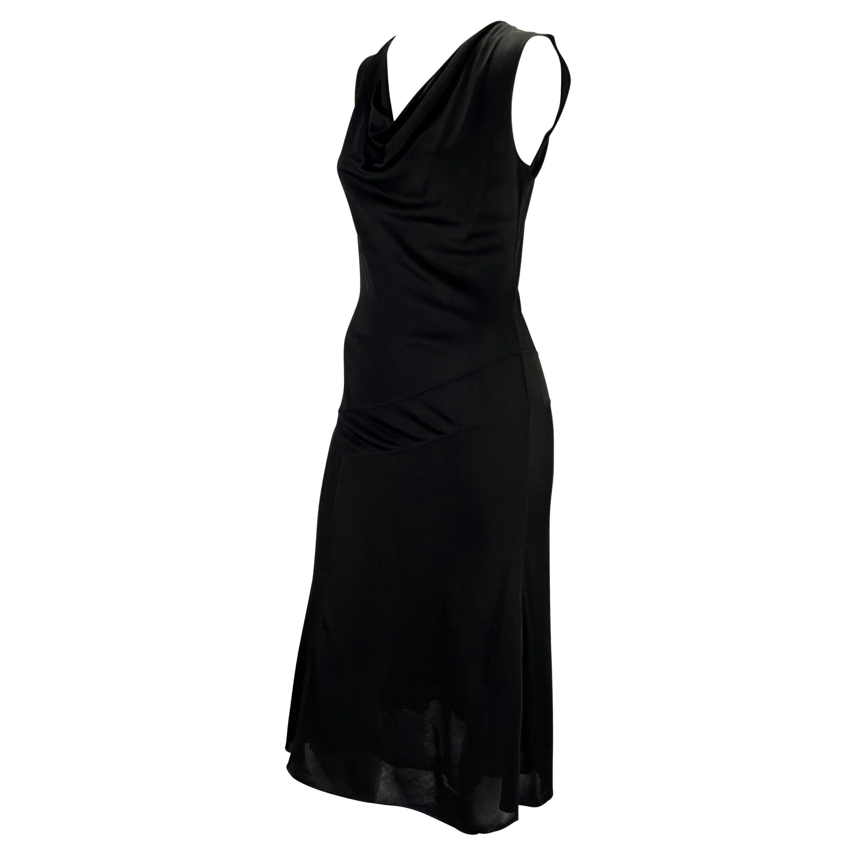 Presenting a sleeveless black cowlneck Gucci dress, designed by Tom Ford. From the early 2000s, this effortlessly chic and elegant dress is constructed of a stretchy knit material that allows the piece to hug your curves. The dress is made complete