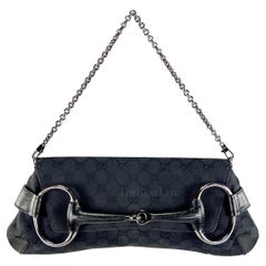 2000s Gucci by Tom Ford Negro GG Monograma Convertible Hosebit Clutch