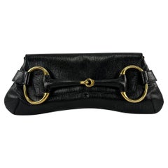 2000s Gucci by Tom Ford Black Leather Gold Hosebit XL Clutch