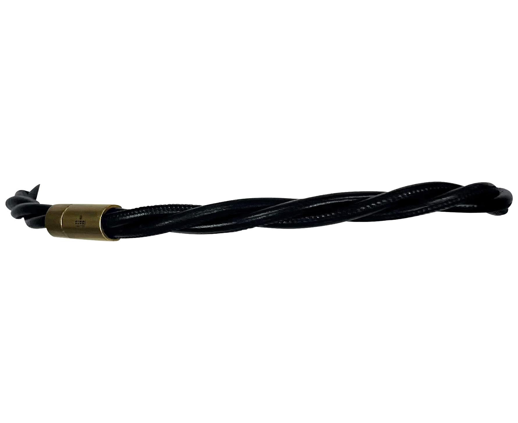Tom Ford designed this braided leather Gucci waist belt in the early 2000s. This chic belt features a black leather strap and a brass-branded closure. 

Approximate Measurements:
Length: 29
