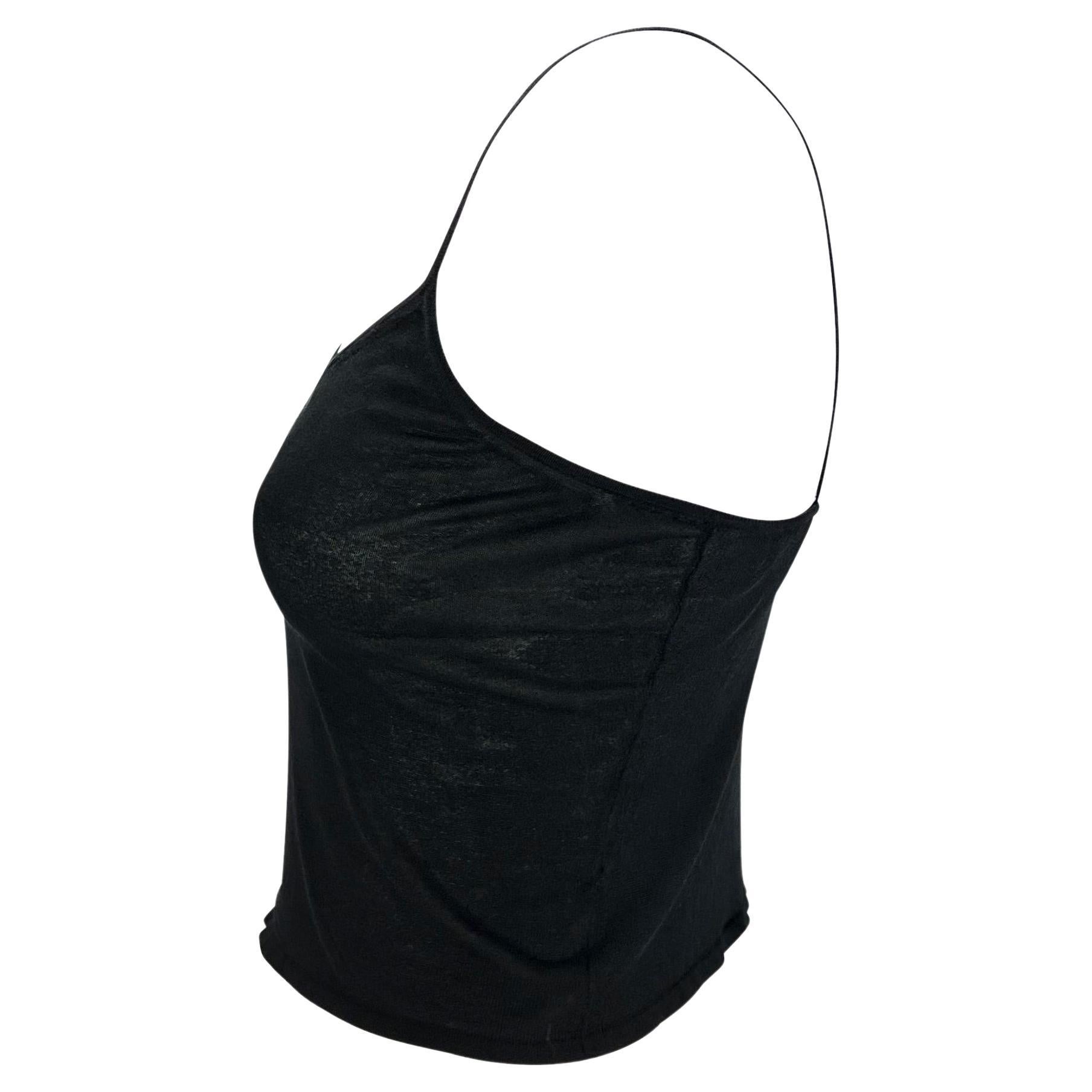 TheRealList presents: a sexy black cropped tank top designed by Tom Ford in the early 2000s for Gucci. The knit fabric stretches to perfectly hug the body and is sheer enough to reveal peeks of the wearer's body. This piece is a chic example of