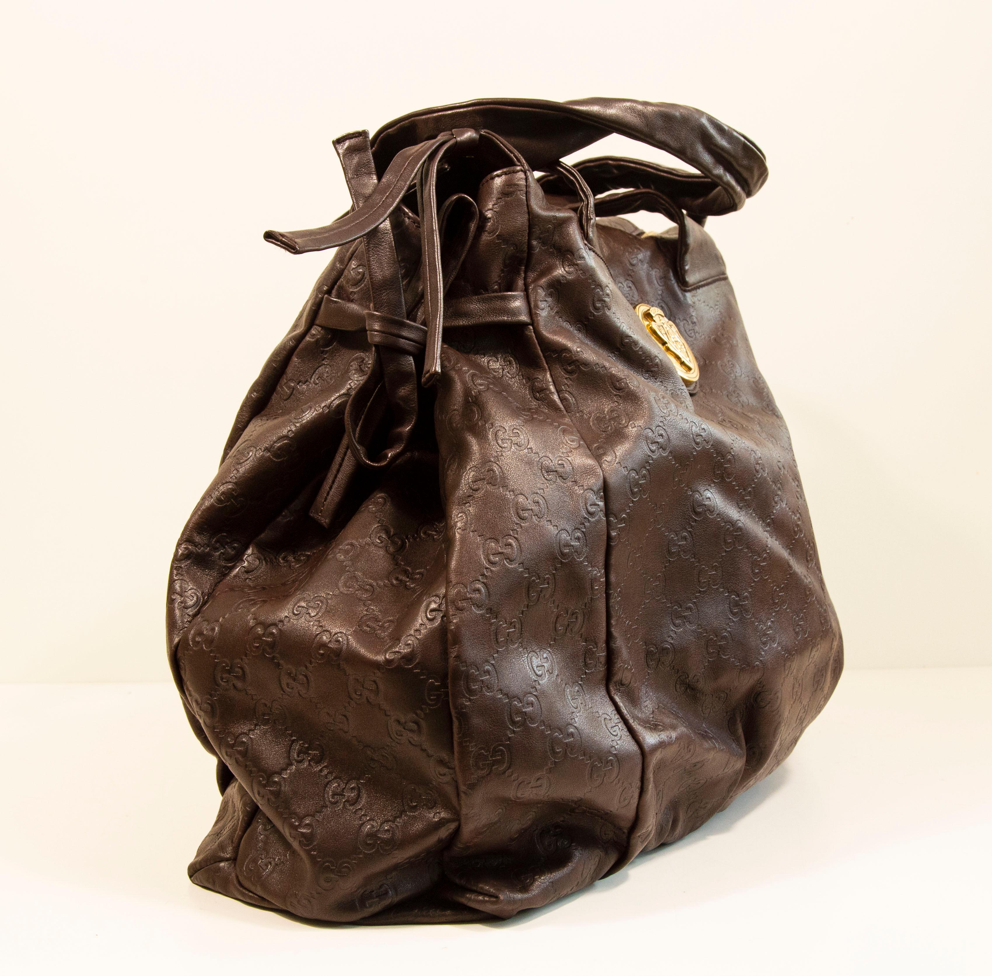 Women's or Men's 2000s Gucci GG Embossed Brown Leather Hysteria Handbag For Sale