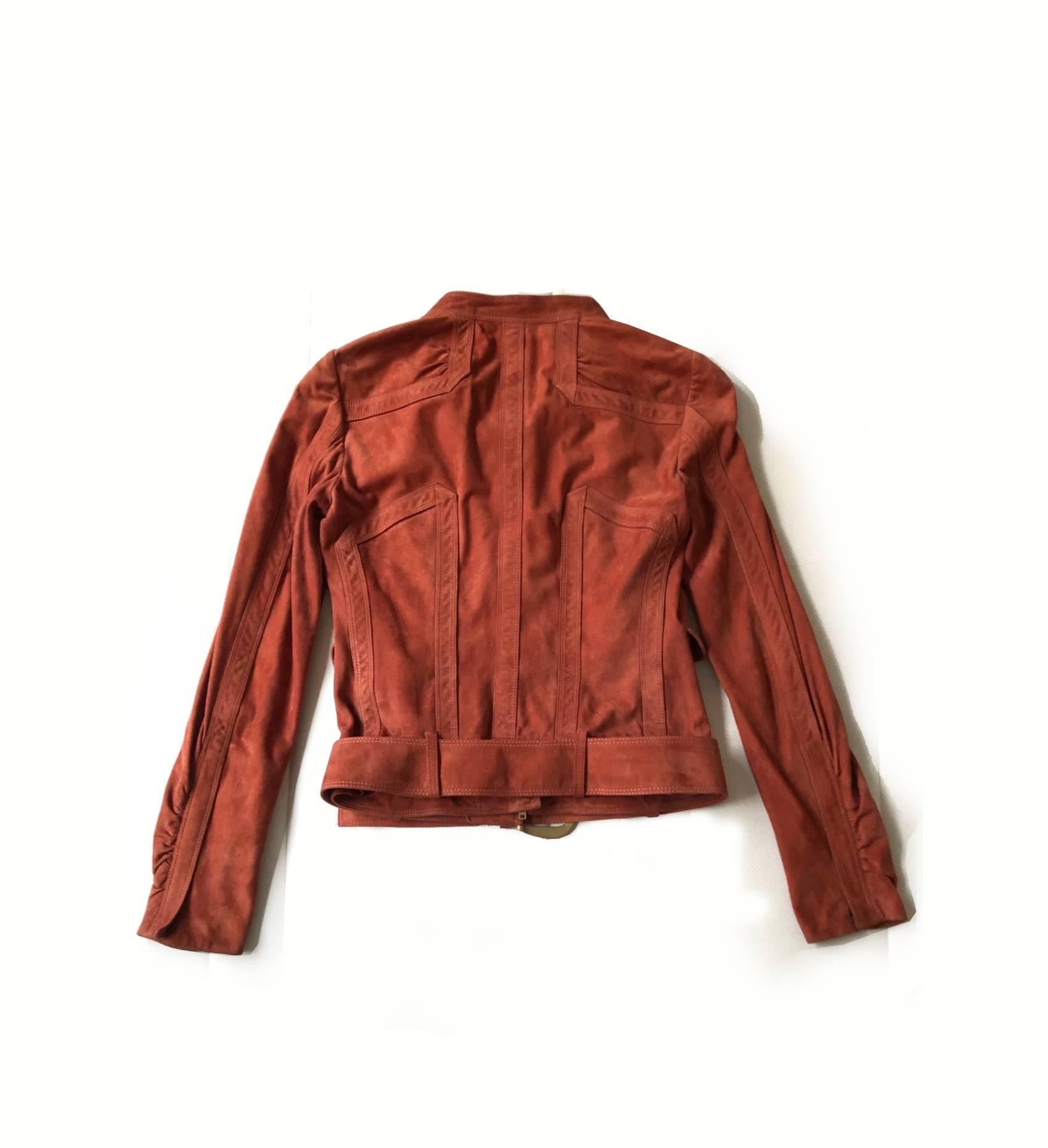 FREE UK and WORLDWIDE DELIVERY 

Gucci suede biker jacket, terracotta lobster orange colour, two front pockets, front zip half way closure, zip closure detail on both sleeves, bottom belt, gold tone metal-ware

Size: Small, 40 Italian, 8 UK, 0-2 USA