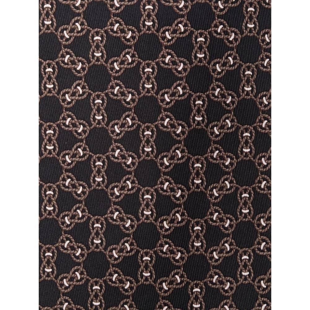Hermès black silk with braided ropes print pattern tie. Model with pointed design. 
Years: 2000s
Made in France
Width: 9 cm