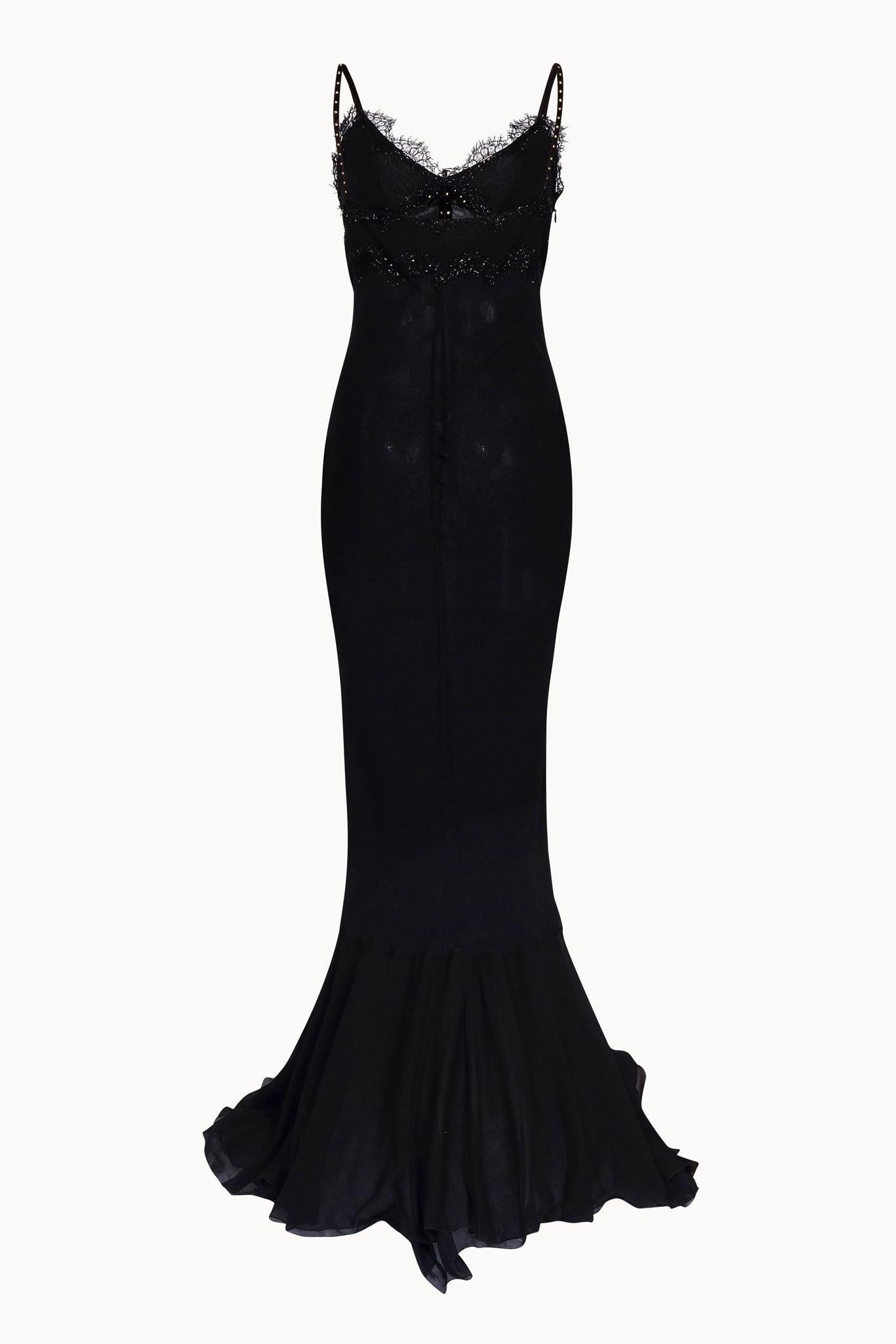 Gorgeous and very feminine 2000s Iceberg black chiffon silk gown. Features delicate lace appliqués on breast, long velvet ties covered with golden spots and and ending with enamel hearts, and mermaid tail shape.