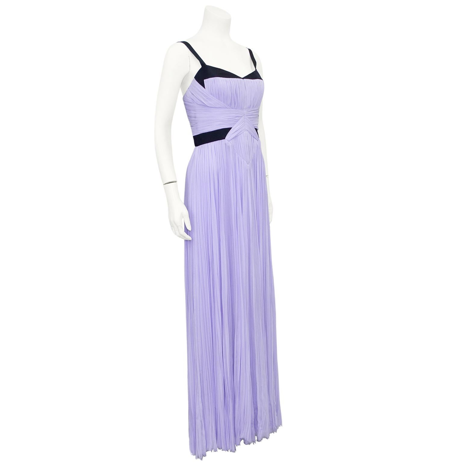 This J. Mendel evening gown from the mid 2000s is absolutely stunning. Micro pleated lilac silk chiffon with contrasting black silk twill ribbon colour blocking. Spaghetti straps with a very slight v neck line. Fitted through the waist with a