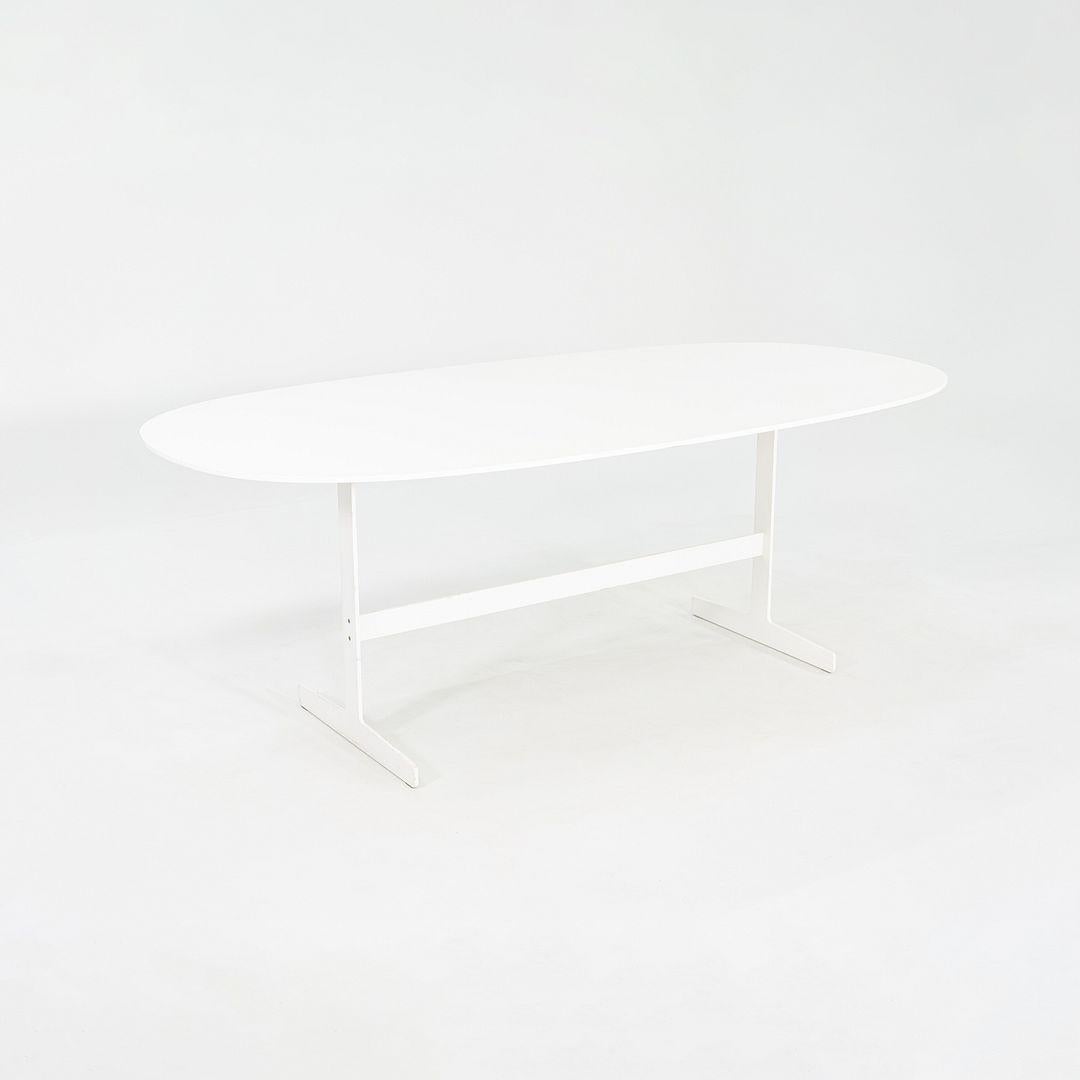 This is a Simplon Dining Table, originally designed by Jasper Morrison for Cappellini in 2003. This particular example dates to the 2000s. The table is comprised of an anodized aluminum base with a white laquered tabletop. 
 
 The table measures