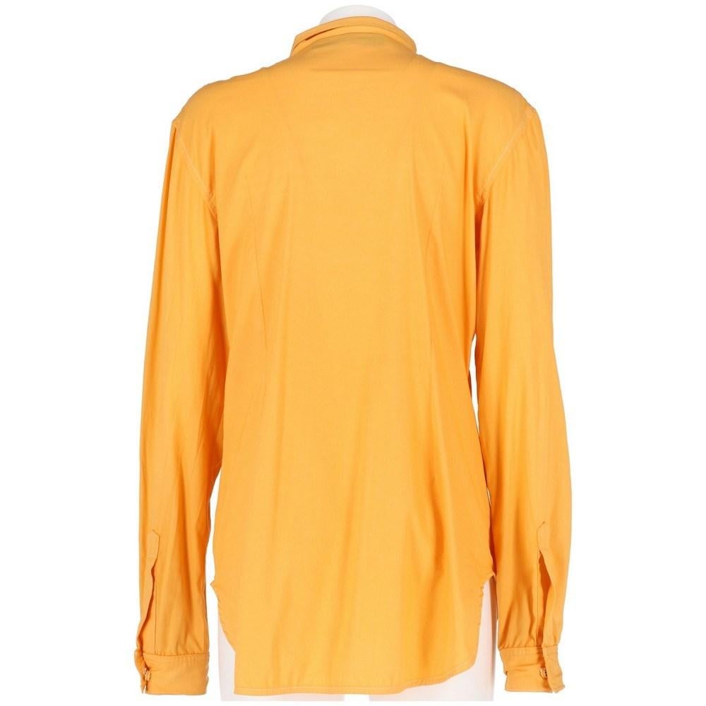 Jeremy Scott light orange cotton pleated shirt. Classic collar and snap buttons fastening.

Size: M/L

Flat measurements
Height: 73 cm
Bust: 50 cm
Shoulders: 44 cm
Sleeves: 66 cm

Product code: X5215

Composition: Cotton

Made in: France

Condition: