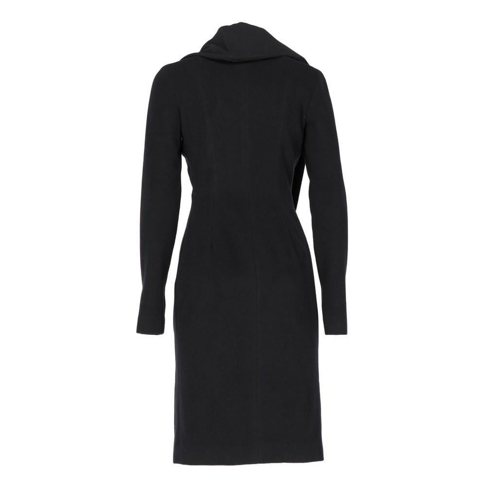 Jil Sander black wool coat. Asimmetrical wide collar. Lateral zip.

Size: 40 IT

Flat measurements
Height: 96 cm
Bust: 39 cm
Shoulders: 42 cm
Sleeves: 63 cm
Waist: 34 cm
Hips: 44 cm

Product code: X0340

Composition: Outer: Wool
Lining: