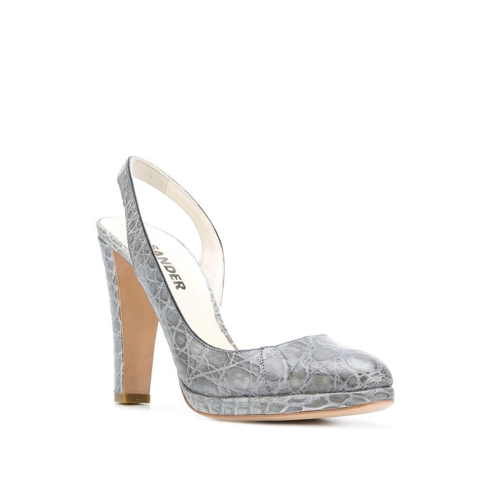 Jil Sander crocodile print grey leather pumps. Ankle strap, high heel, almond toe and platform.

Size: 35,5 IT

Measurements
Insole: 24 cm
Heel: 10 cm
Platform: 1 cm

Product code: A8038

Composition: Leather

Made in: France

Condition: Very good