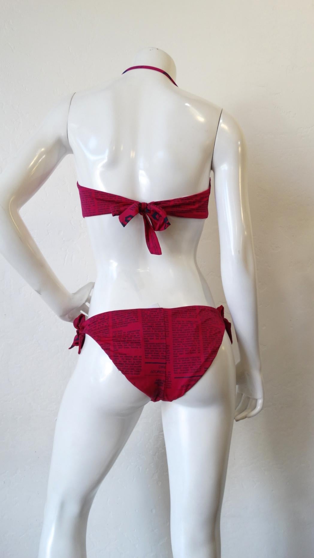 The Most Adorable Swim Suit For Your Next Vacation! Circa 2000s, reminiscent of his Dior Daily print, this fuchsia Galliano bikini once again features the iconic Gazette newspaper print. Halter top has removable halter strap, transforming the top