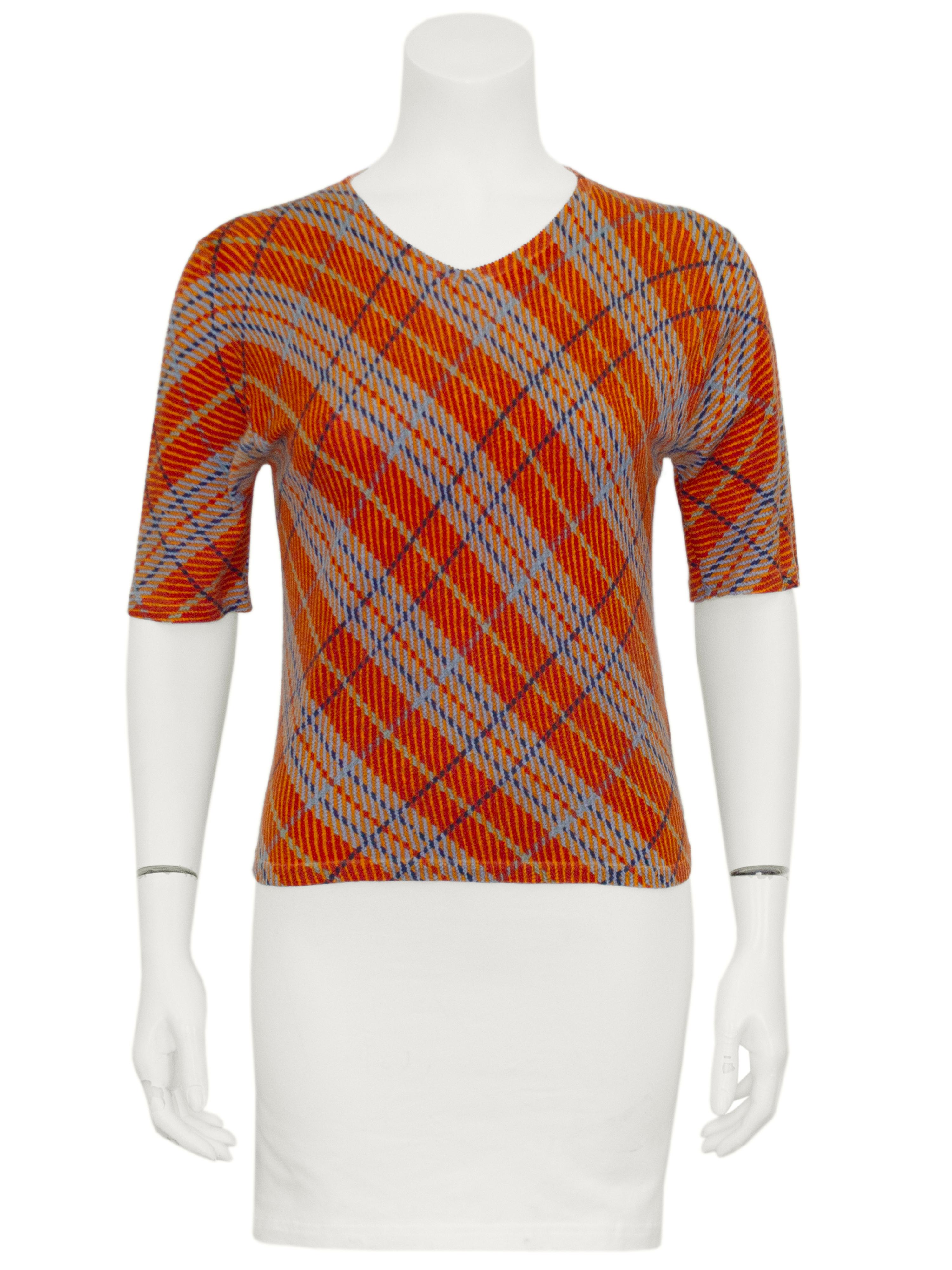 Y2K John Galliano silk and cashmere blend sweater set. Short sleeve shallow v neck pullover with a crewneck cardigan. Printed orange, light blue and navy blue all over argyle. Small pale blue buttons. Lightweight and very soft. Excellent vintage