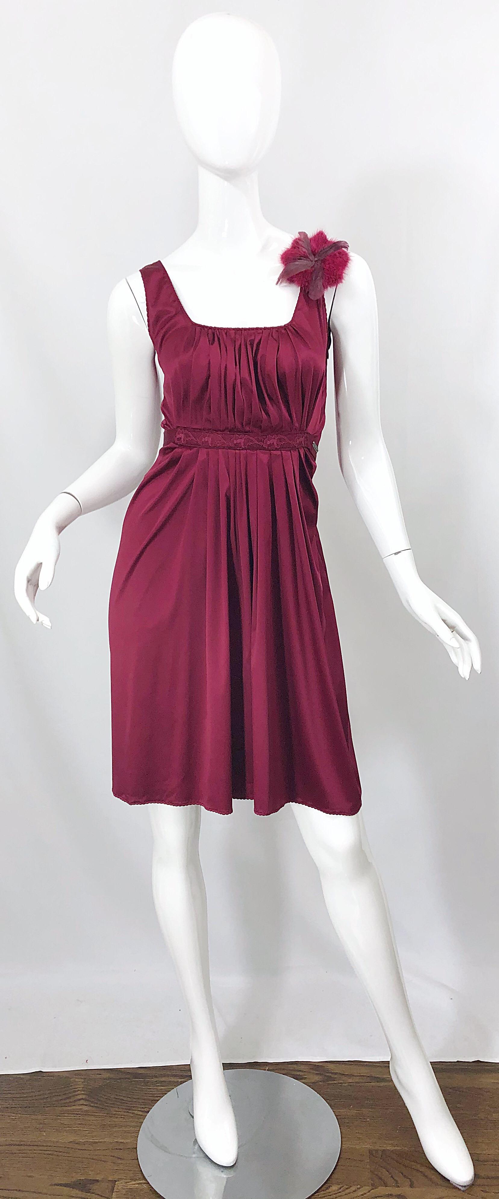 Beautiful early 2000s JOHN GALLIANO burgundy / maroon / merlot silk sleeveless dress with removable feather brooch! Pleated bodice with a tie at back waistband to adjust waist size. Hidden zipper up the side with hook-and-eye closure. Feather brooch