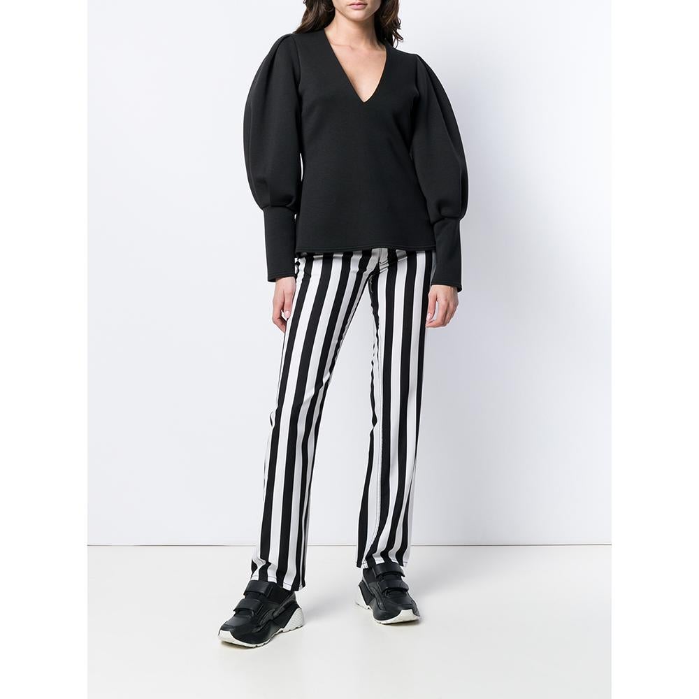 Junya Watanabe Comme des Garcons white and black striped trousers. Polka dot printed waist. Belt loops, transparent front button and zip fastening, front and back pockets, slim fit. 

The item shows slight signs of wear, as showed in the