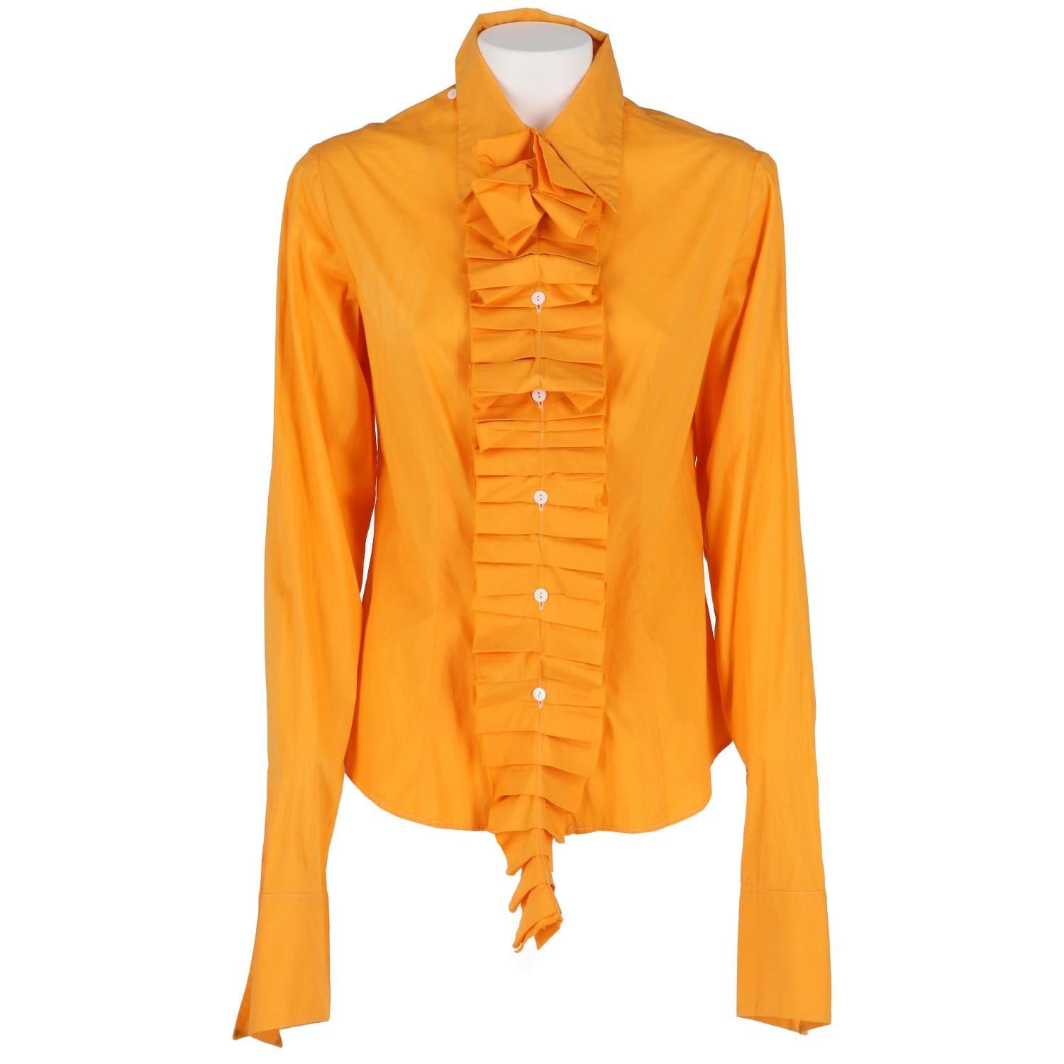 Just Cavalli orange cotton shirt. Classic pointed collar and front closure with white buttons. Removable decorative ruffles.

The product has slight halos on the tips of the collar as shown in the pictures.

Years: 2000s

Made in Italy

Size: 42