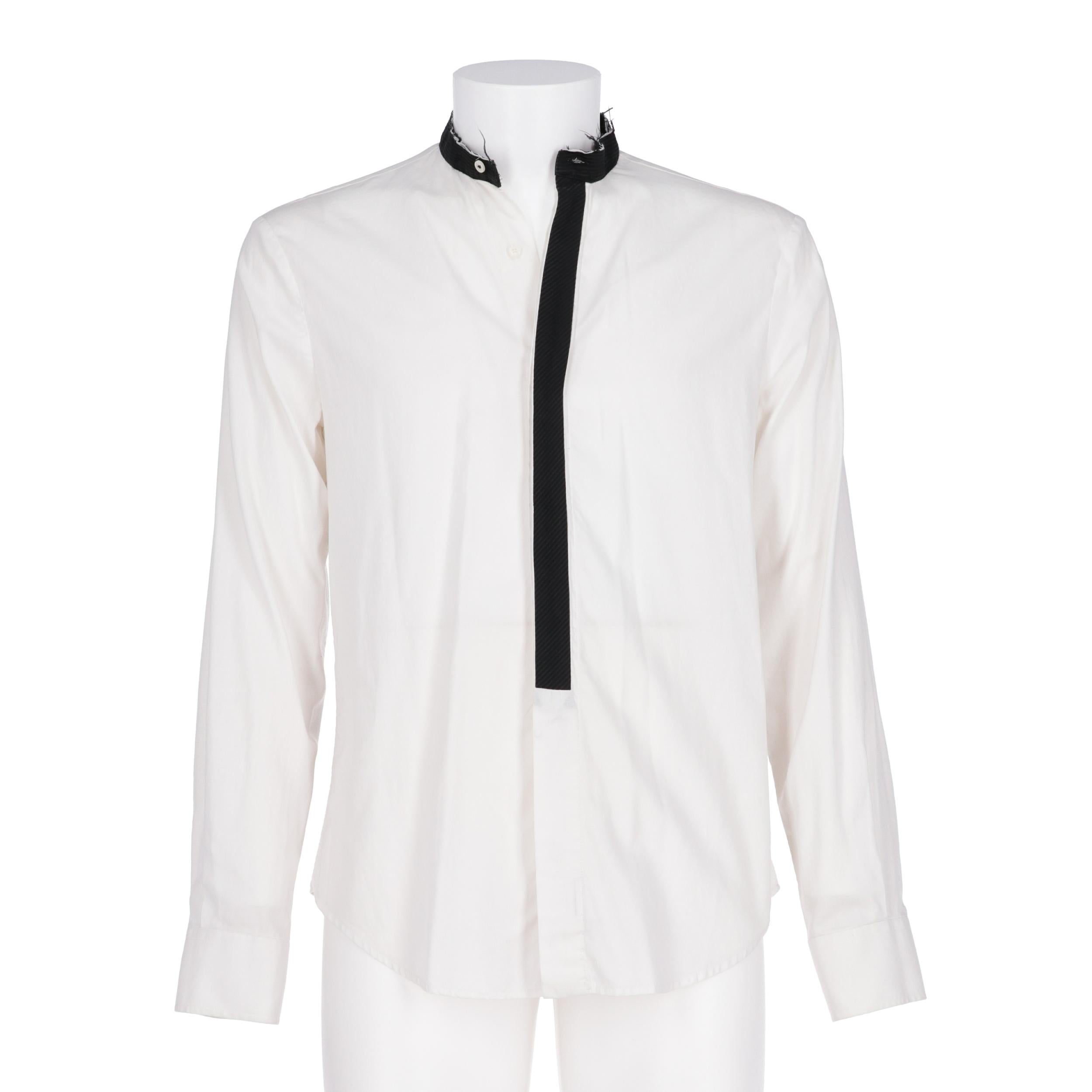 A.N.G.E.L.O. Vintage - ITALY
Just Cavalli white cotton shirt. Raw cut mandarin collar, English fastening with buttons and black wool finishing. Long sleeves and buttoned cuffs.

Years: 2000s

Made in Italy

Size: 48 IT

Flat measurements

Height: 74