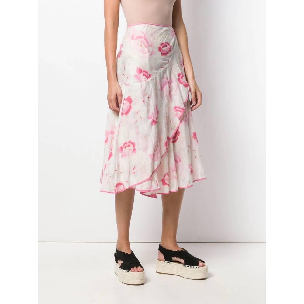 Kenzo wallet skirt in cotton with floral pattern in shades of white, orange and pink, a high waist and side strap closure.
Years: 2000s

Made in France

Size: M

Linear measures

Height: 75 cm
Waist: adjustable