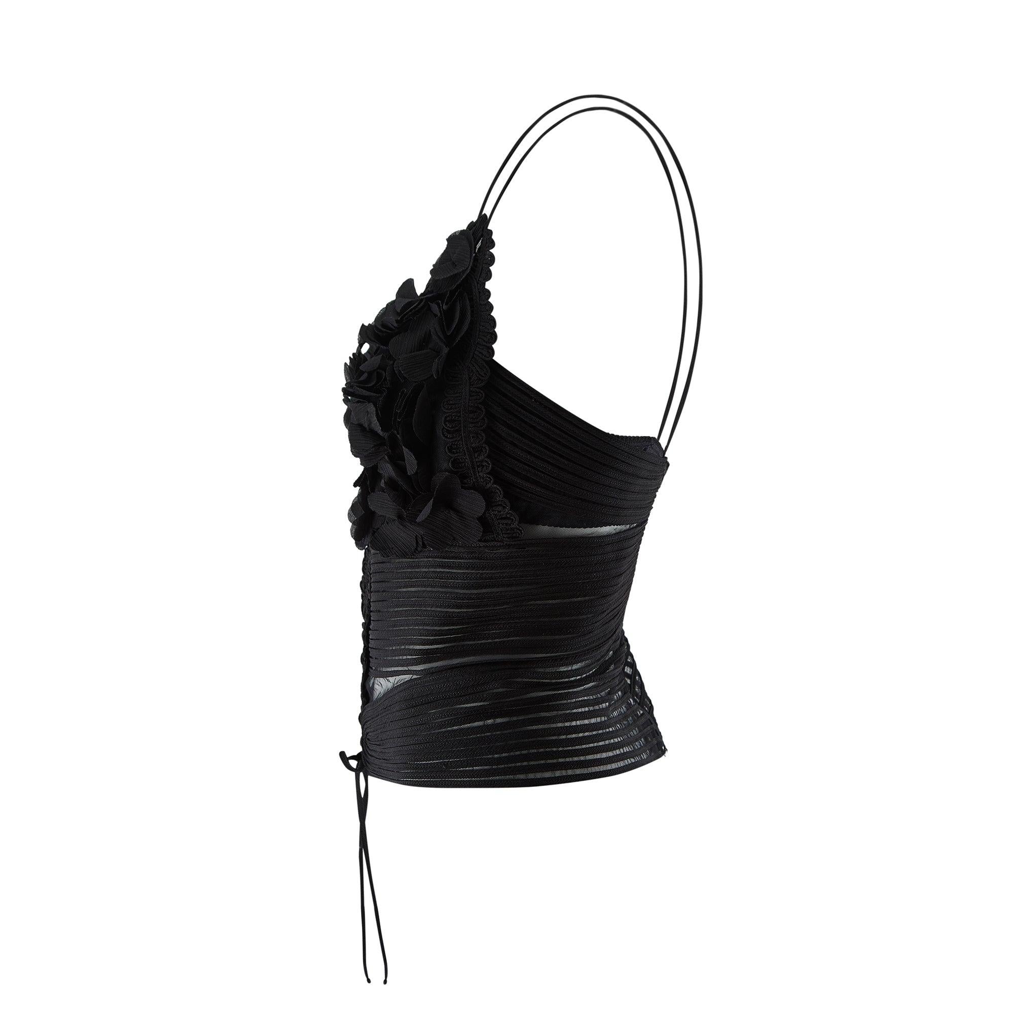This black peekaboo corset style camisole was designed circa 2000-2003 by La Perla, the Italian lingerie super brand founded by couturière and corset-maker Ada Masotti in 1954. It is impeccably crafted from a base of mesh with elaborate ribbon work