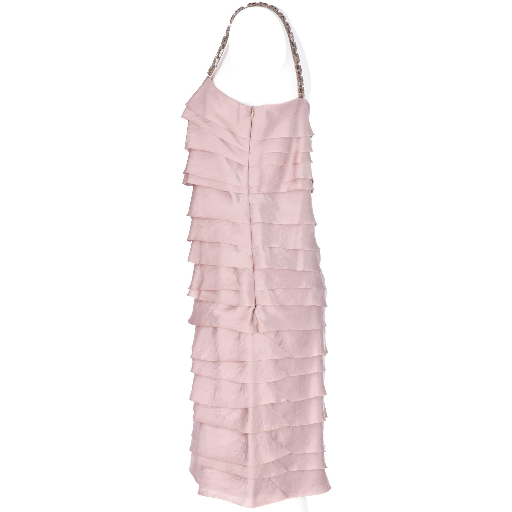 Lanvin antique pink dress long above the knee, straight neckline, flounces along the dress and straps decorated with large and transparent stones, side closure with invisible zip.

The item has slight signs of wear on a stone as shown in the